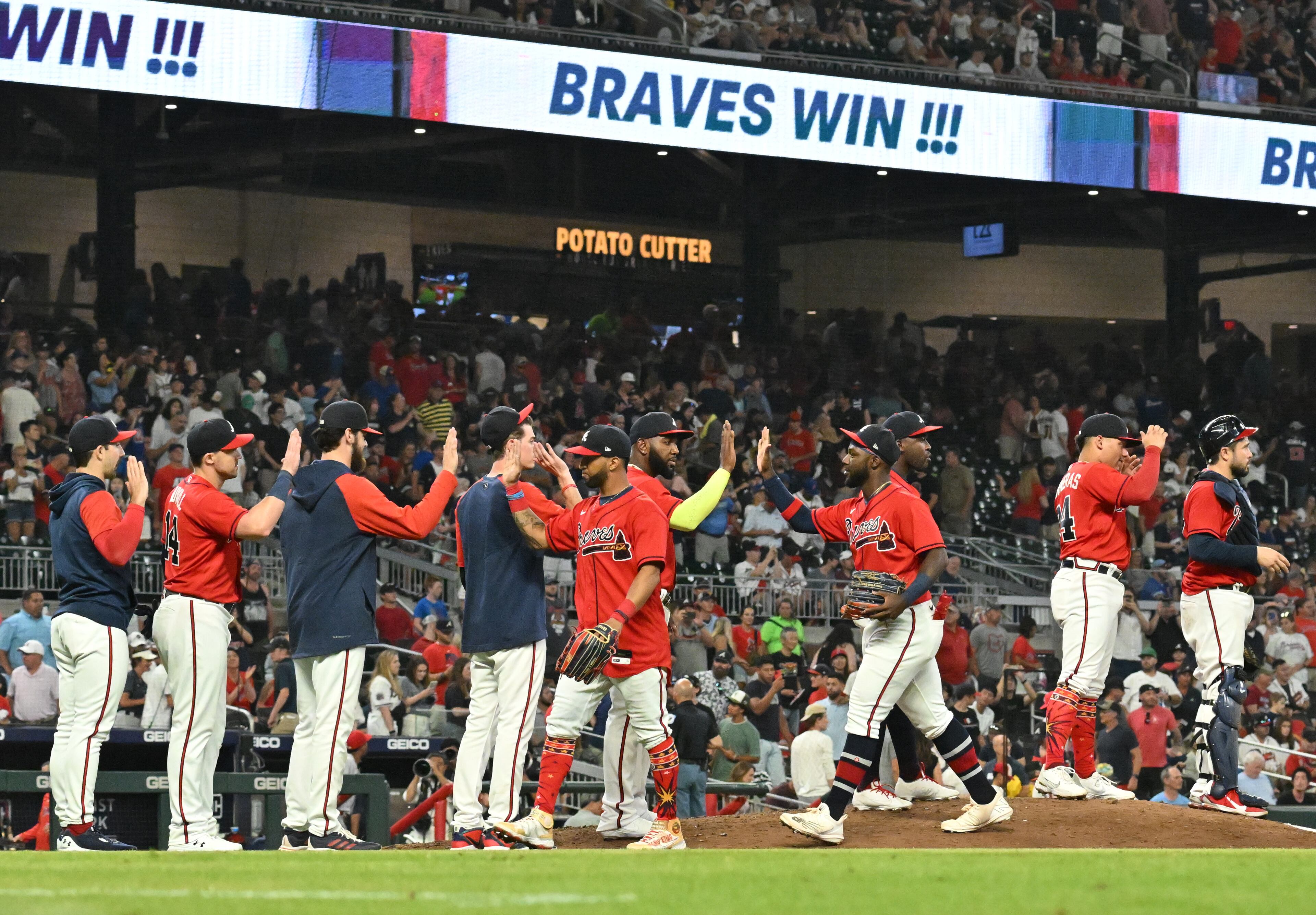 Braves players celebrate their victory over the Los Angeles Angels at Truist Park on Friday, July 22, 2022. Atlanta Braves won 8-1 over Los Angeles Angels. (Hyosub Shin / Hyosub.Shin@ajc.com)