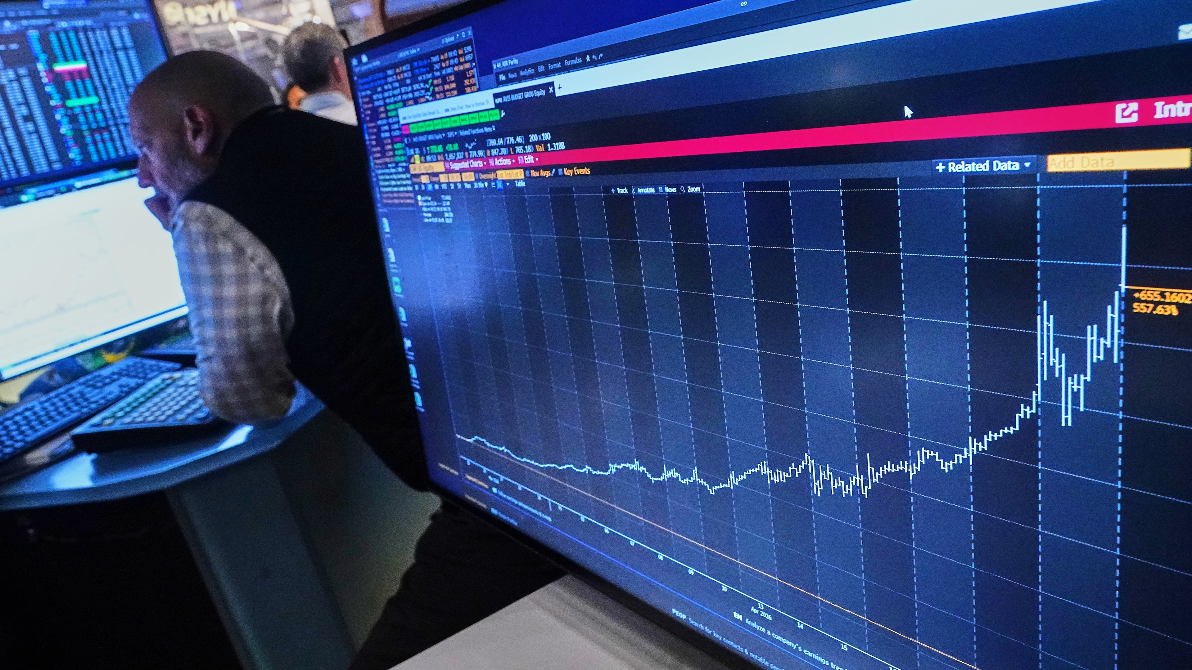 Specialist Meric Greenbaum works on the floor of the New York Stock Exchange, Wednesday, April 22, 2026. (AP Photo/Richard Drew)