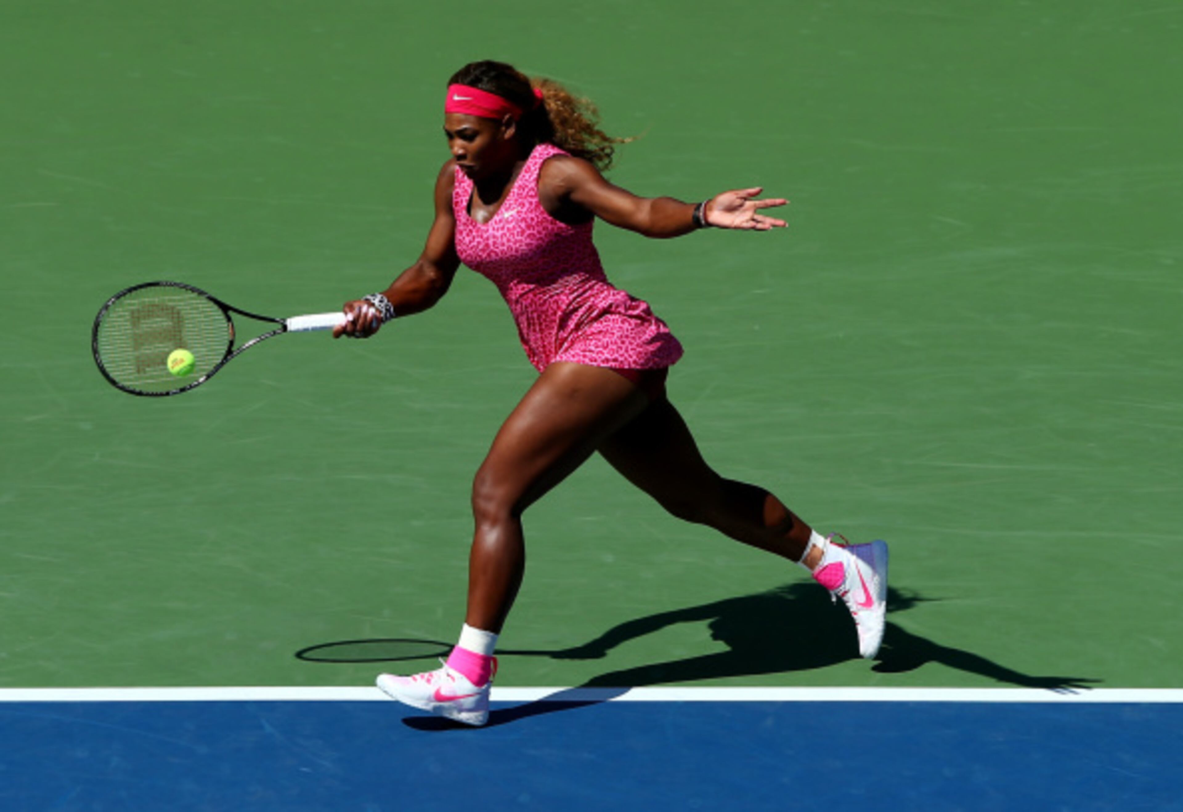 NEW YORK, NY - AUGUST 28: Serena Williams of the United States returns a shot against Vania King of the United States during their women's singles second round match on Day Four of the 2014 US Open at the USTA Billie Jean King National Tennis Center on August 28, 2014 in the Flushing neighborhood of the Queens borough of New York City. (Photo by Elsa/Getty Images)