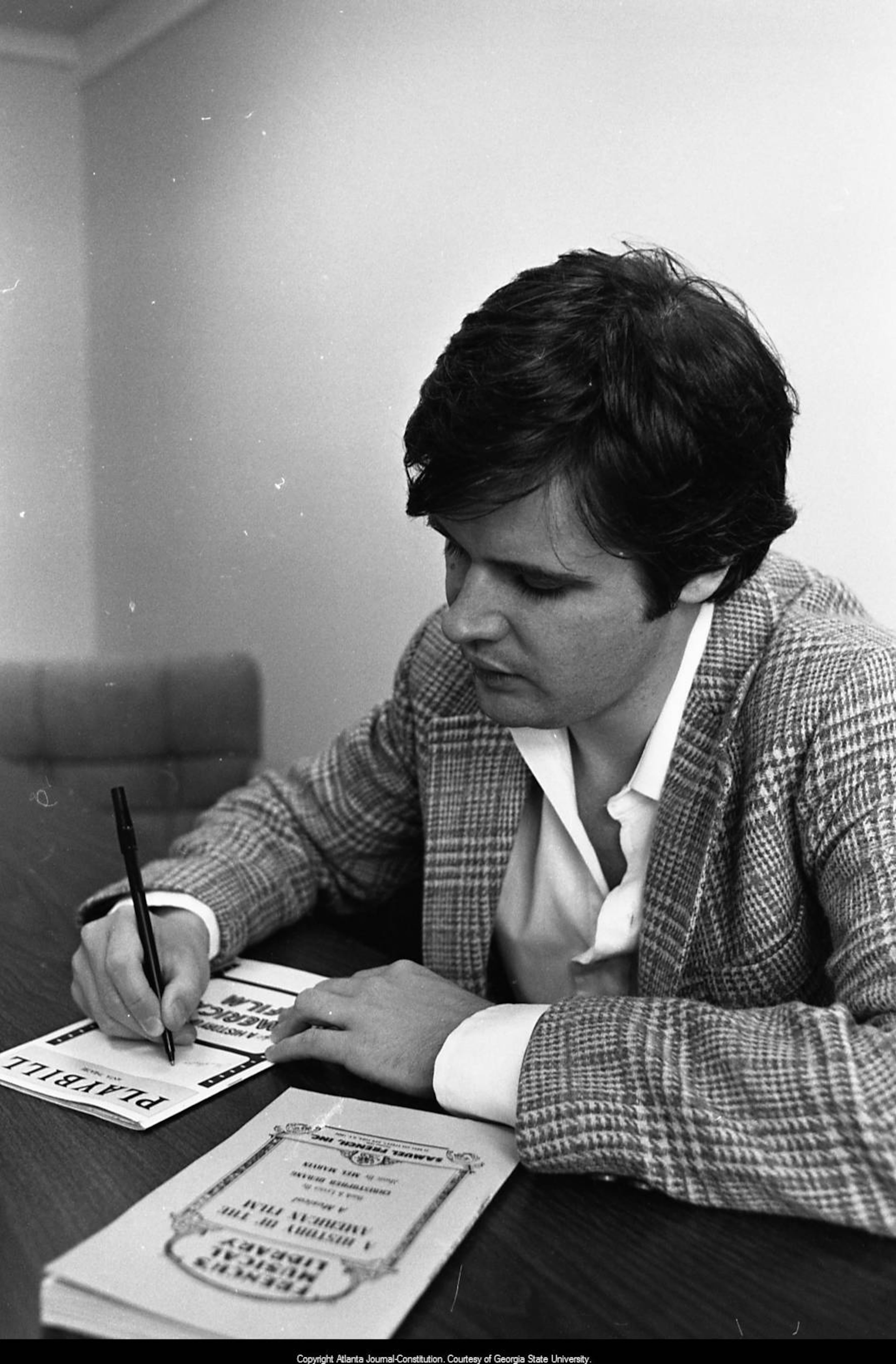 American playwright Christopher Durang signs playbills in Atlanta, Georgia, September 26, 1980. PHOTO BY STEVE HELBER / AJC ARCHIVES