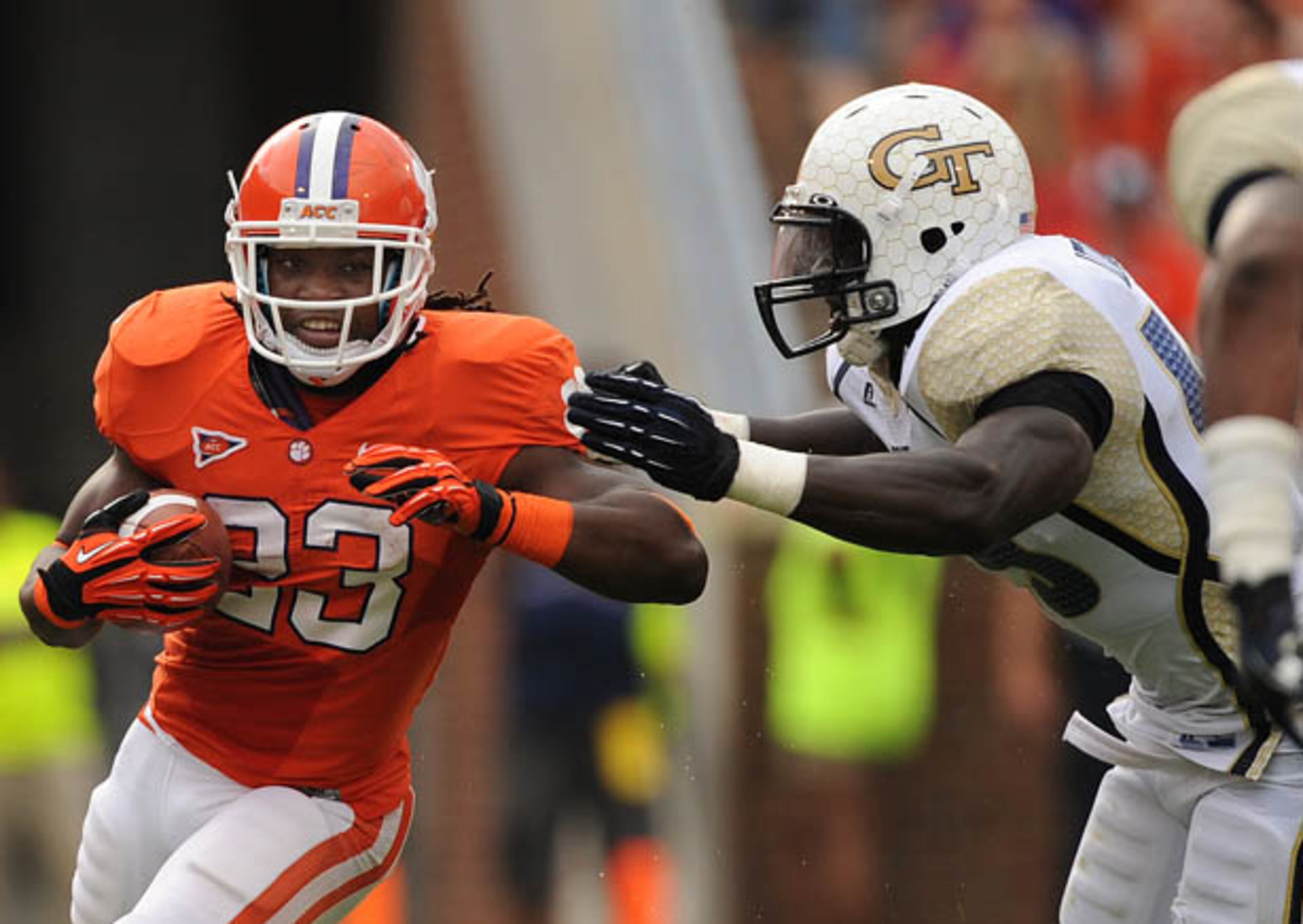 Clemson's Andre Ellington (23) tries to get by Tech's Jeremiah Attaochu.