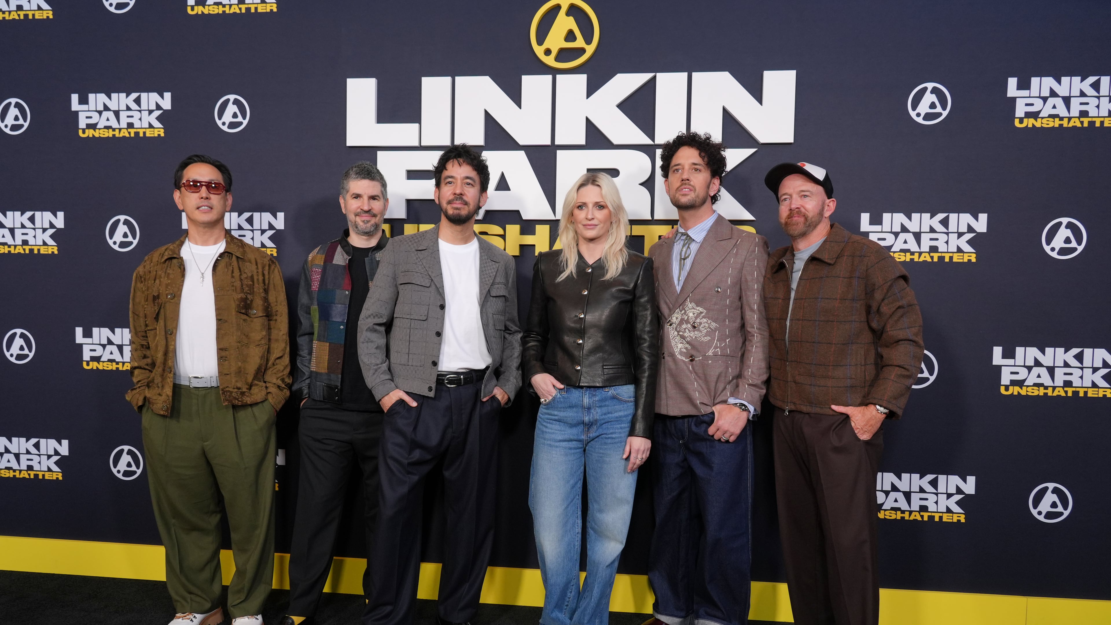 From left, Joe Hahn, Brad Delson, Mike Shinoda, Emily Armstrong, Colin Brittain and Dave Farrell of the band Linkin Park pose together at the premiere of the documentary film "Linkin Park: Unshatter" on Thursday, Sept. 24, 2026, at AMC The Grove 14 in Los Angeles. (AP Photo/Chris Pizzello)