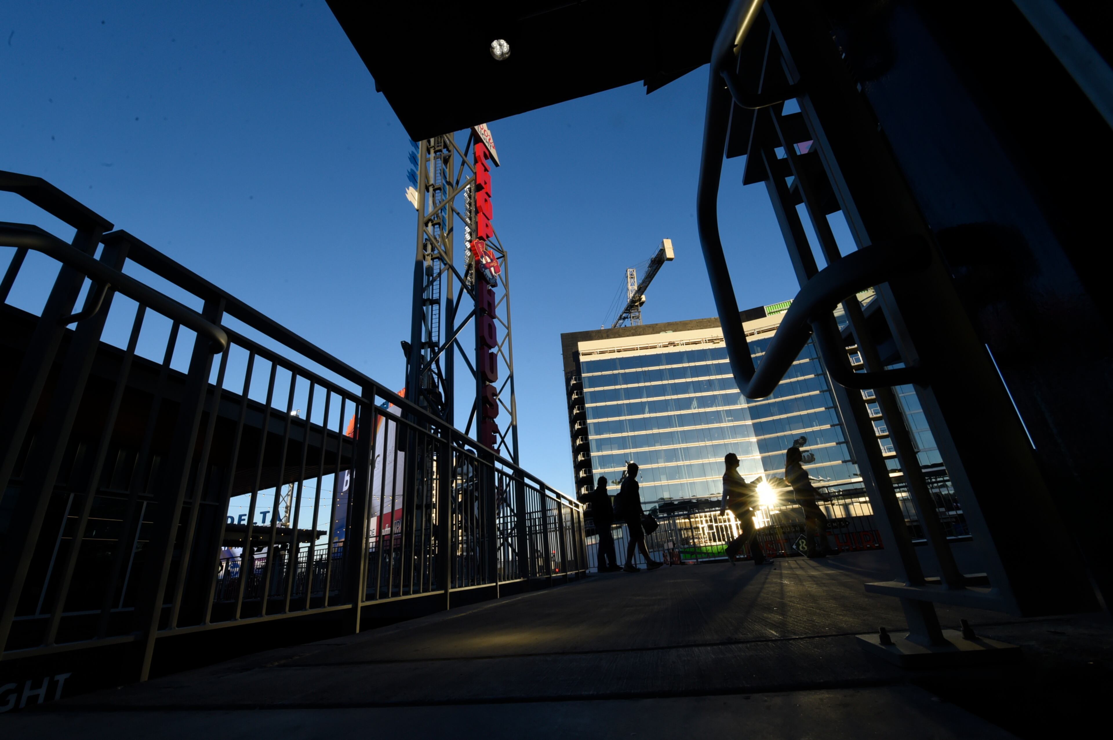 March 31, 2017, Atlanta, Georgia - Fans walk across a deck that leads from seating to a restaurant at the Atlanta Braves Exhibition game in SunTrust Park where the Braves played the New York Yankees in Atlanta, Georgia, on March 31, 2017. (HENRY TAYLOR / HENRY.TAYLOR@AJC.COM)