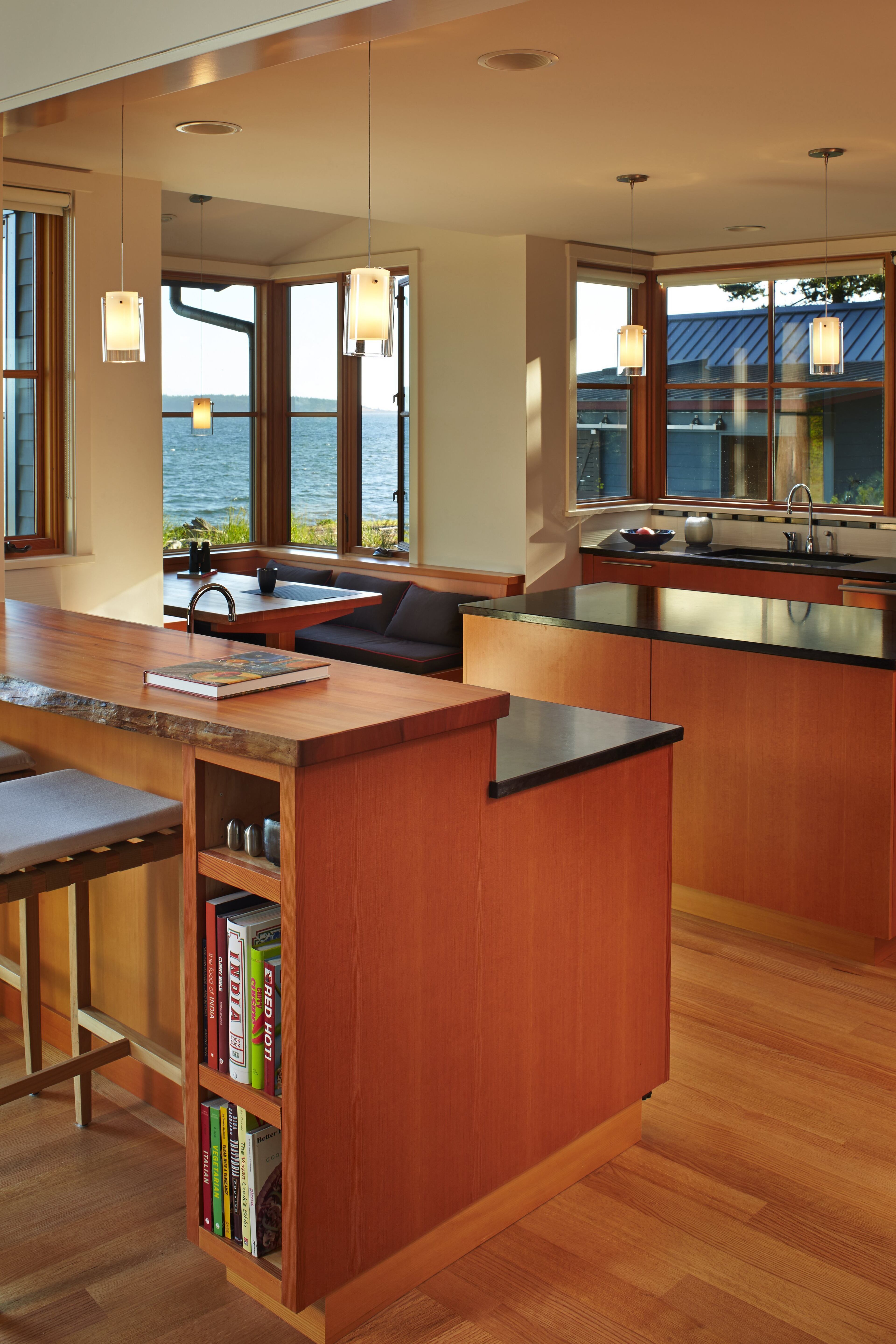 The Boones required a large kitchen. "You really don't want two people in a tight kitchen with knives," says Richard. Mark Padbury of Buckhorn Farm crafted the cabinetry. The live-edge bar is madrona. Counters are granite. Floors are red oak with radiant heat. (Benjamin Benschneider/Seattle Times/MCT)