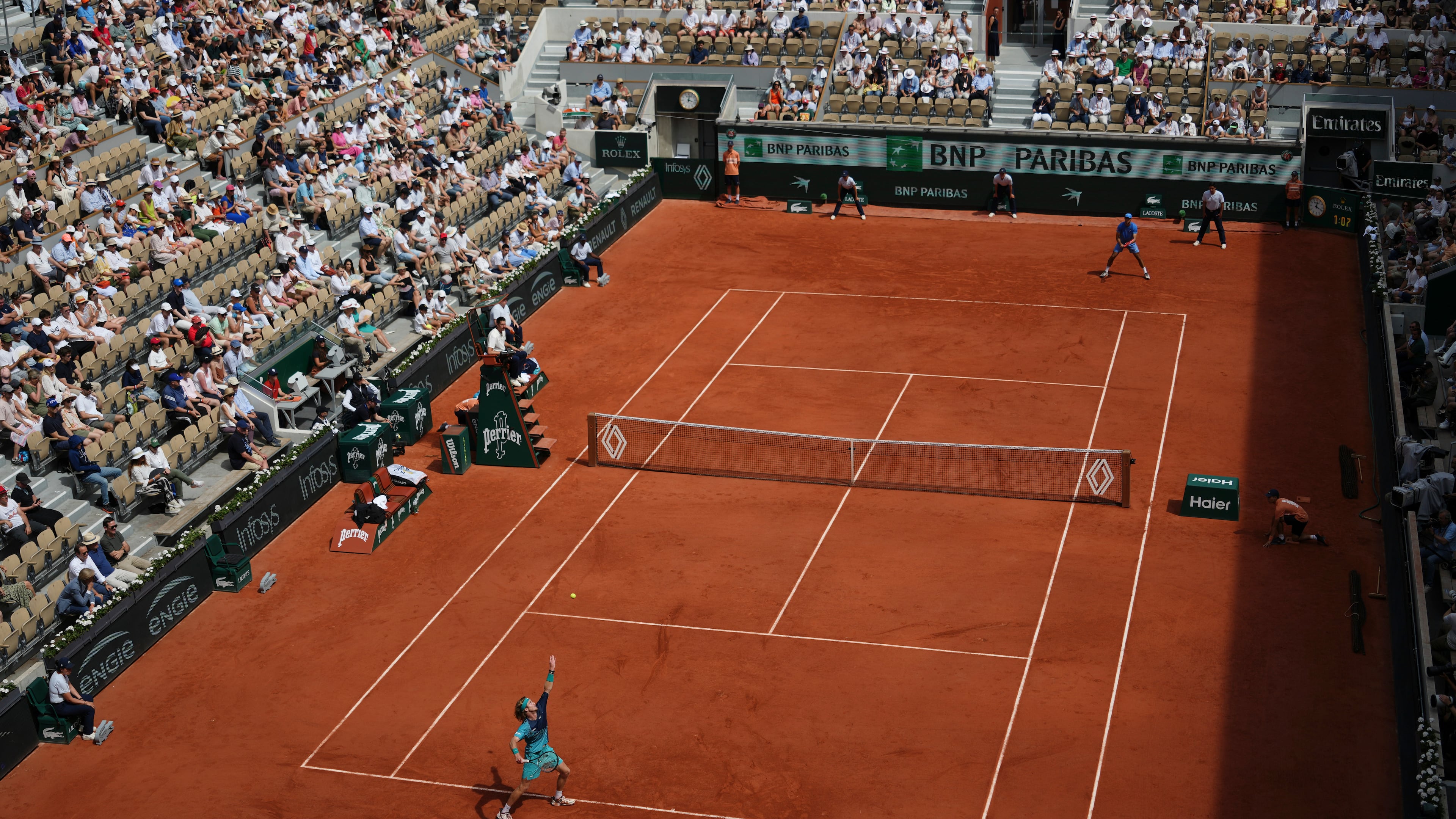 Andrey Rublev of Russia, bottom, serves to Nuno Borges of Portugal during their third round men's singles tennis match at the French Open tennis tournament in Paris, Friday, May 29, 2026. (AP Photo/Aurelien Morissard)