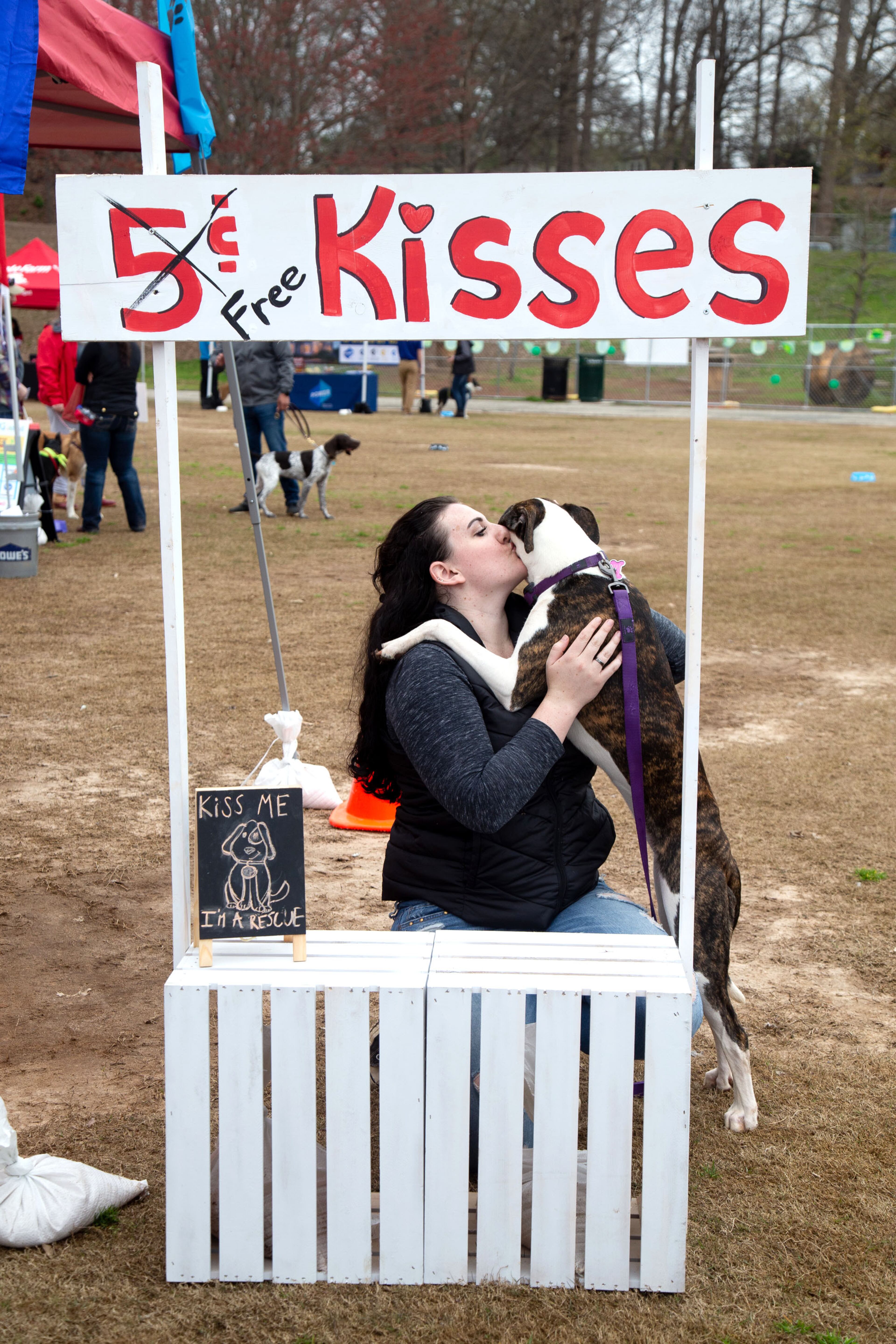 Samantha Conley tries to get a kiss from her dog Roy during a dog kissing competition at The Rescue Dog Games at Piedmont Park on Sunday, March 10, 2019. STEVE SCHAEFER / SPECIAL TO THE AJC
