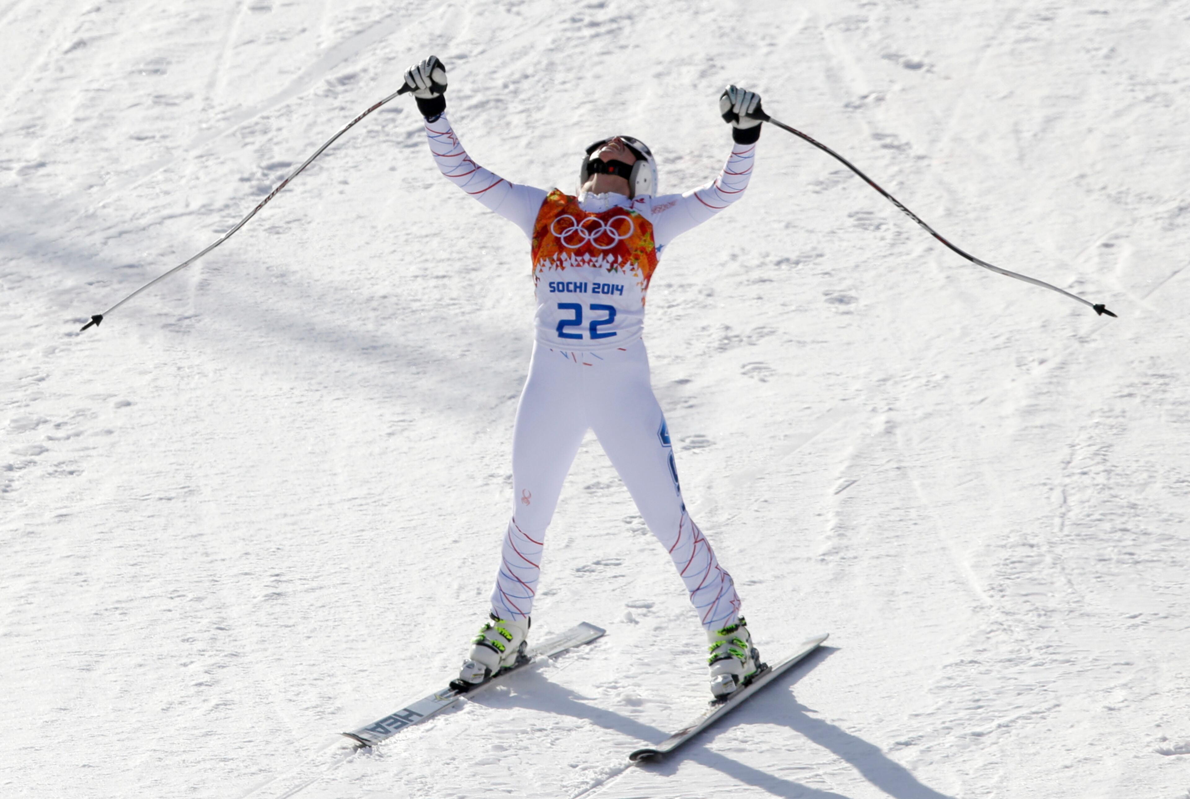 United States' Julia Mancuso celebrates after finishing the downhill portion of the women's supercombined at the Sochi 2014 Winter Olympics, Monday, Feb. 10, 2014, in Krasnaya Polyana, Russia. (AP Photo/Gero Breloer)