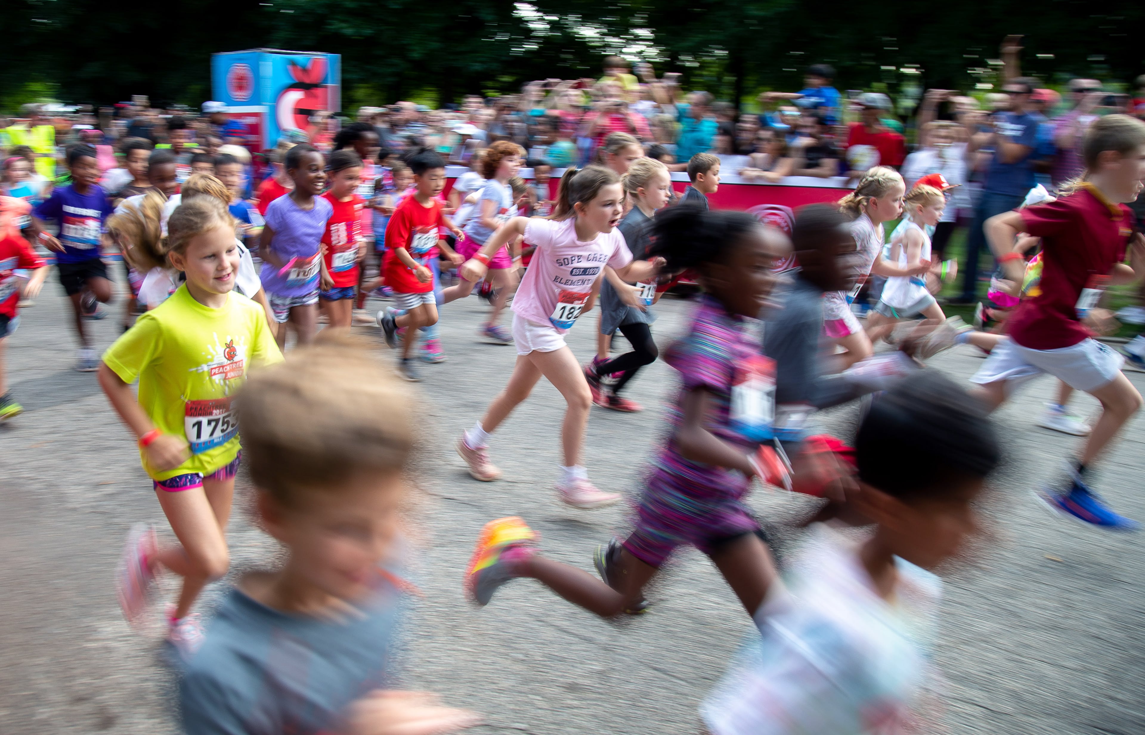 Runners head out on the one-mile run during The Anthem Peachtree Junior race in Piedmont Park Wednesday, July 3, 2019. STEVE SCHAEFER / SPECIAL TO THE AJC