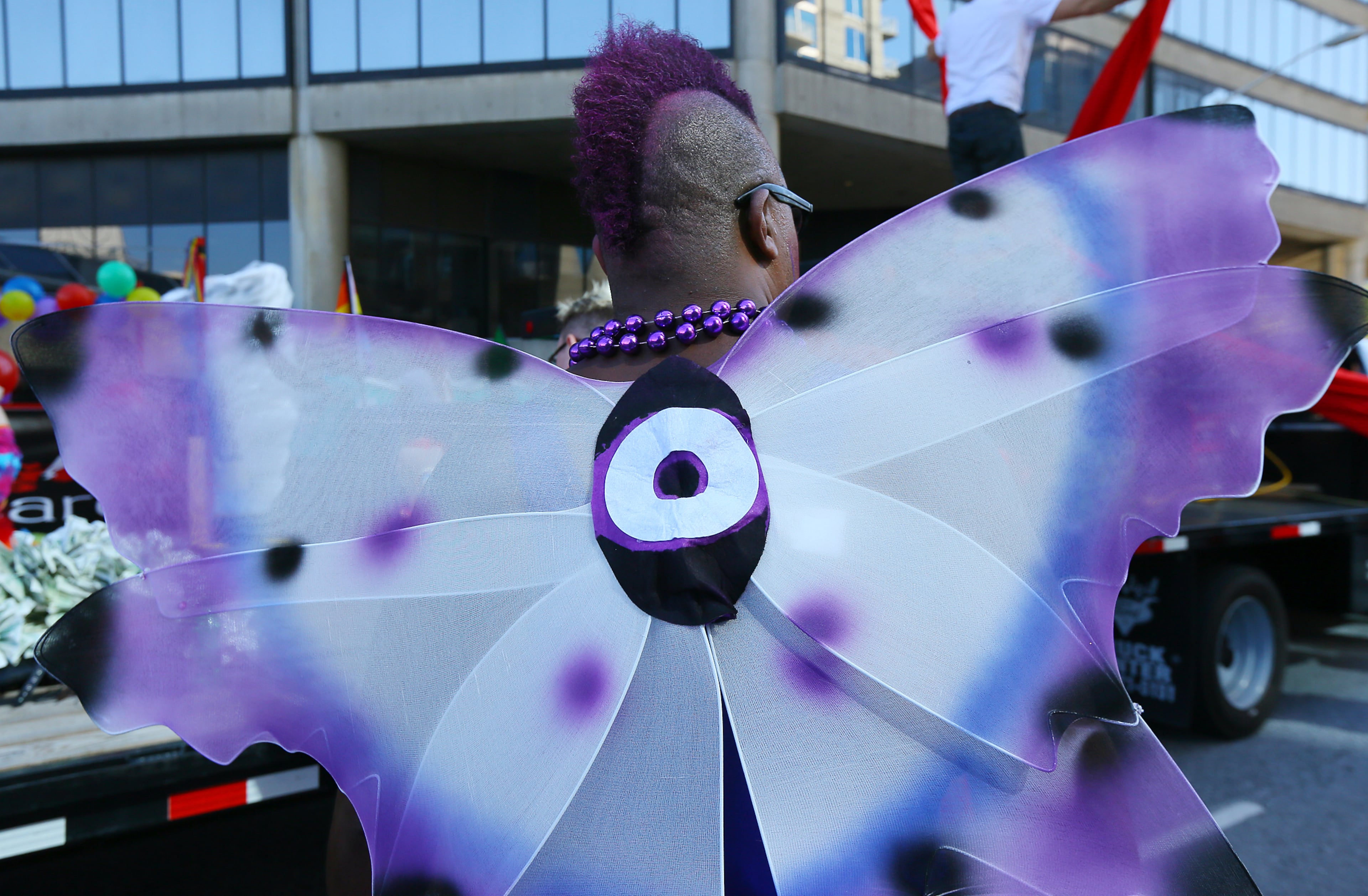 Fred Allen fashions purple wings for the Pride Parade kicking off the 43rd Annual Pride Festival on Sunday, Oct. 13, 2013, in Atlanta. CURTIS COMPTON /staff CCOMPTON@AJC.COM