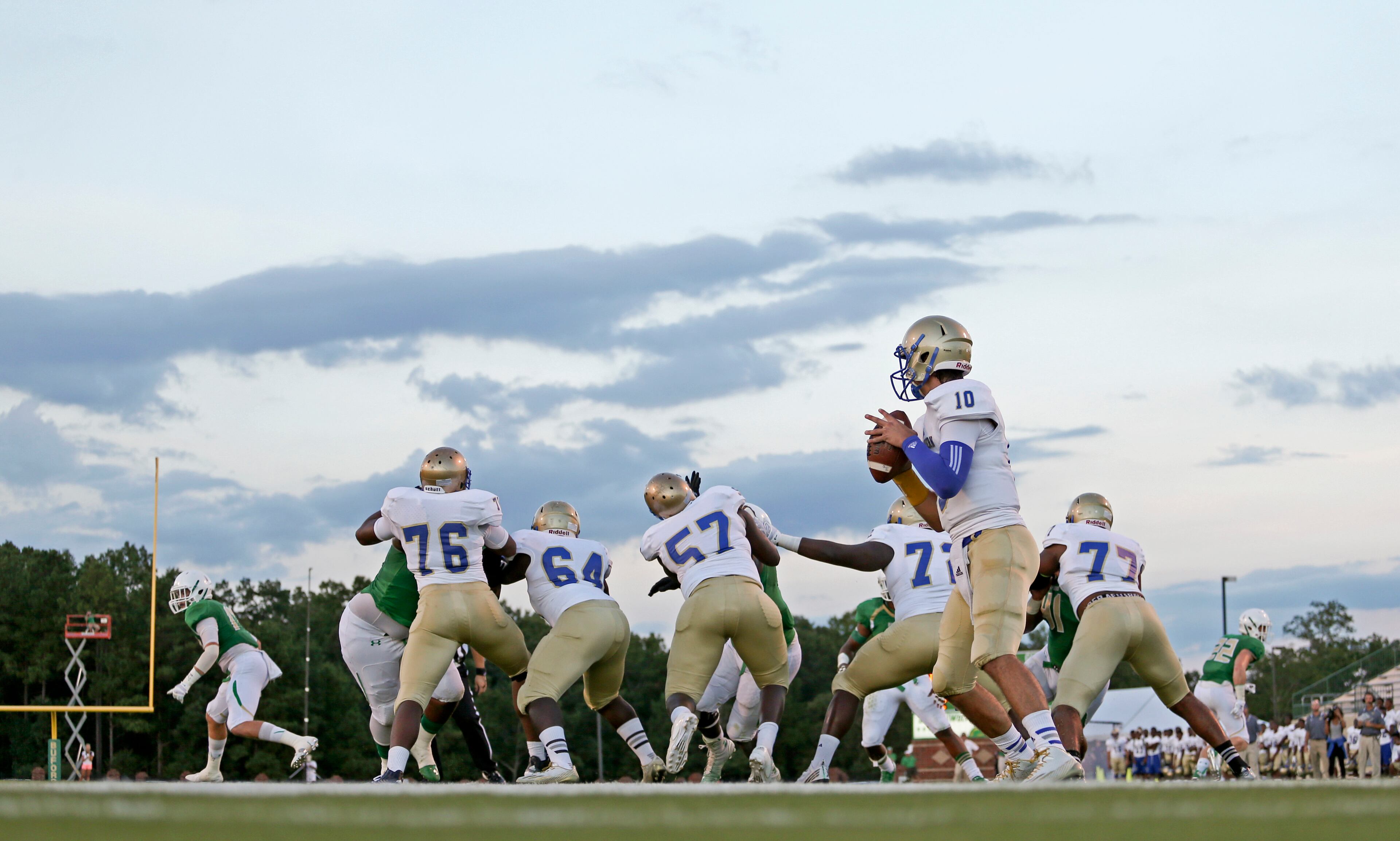 McEachern quarterback Bailey HOckman (10) drops back to pass in the first half of their game against Buford Friday in Buford, Ga., Sept. 5, 2014. JASON GETZ / SPECIAL