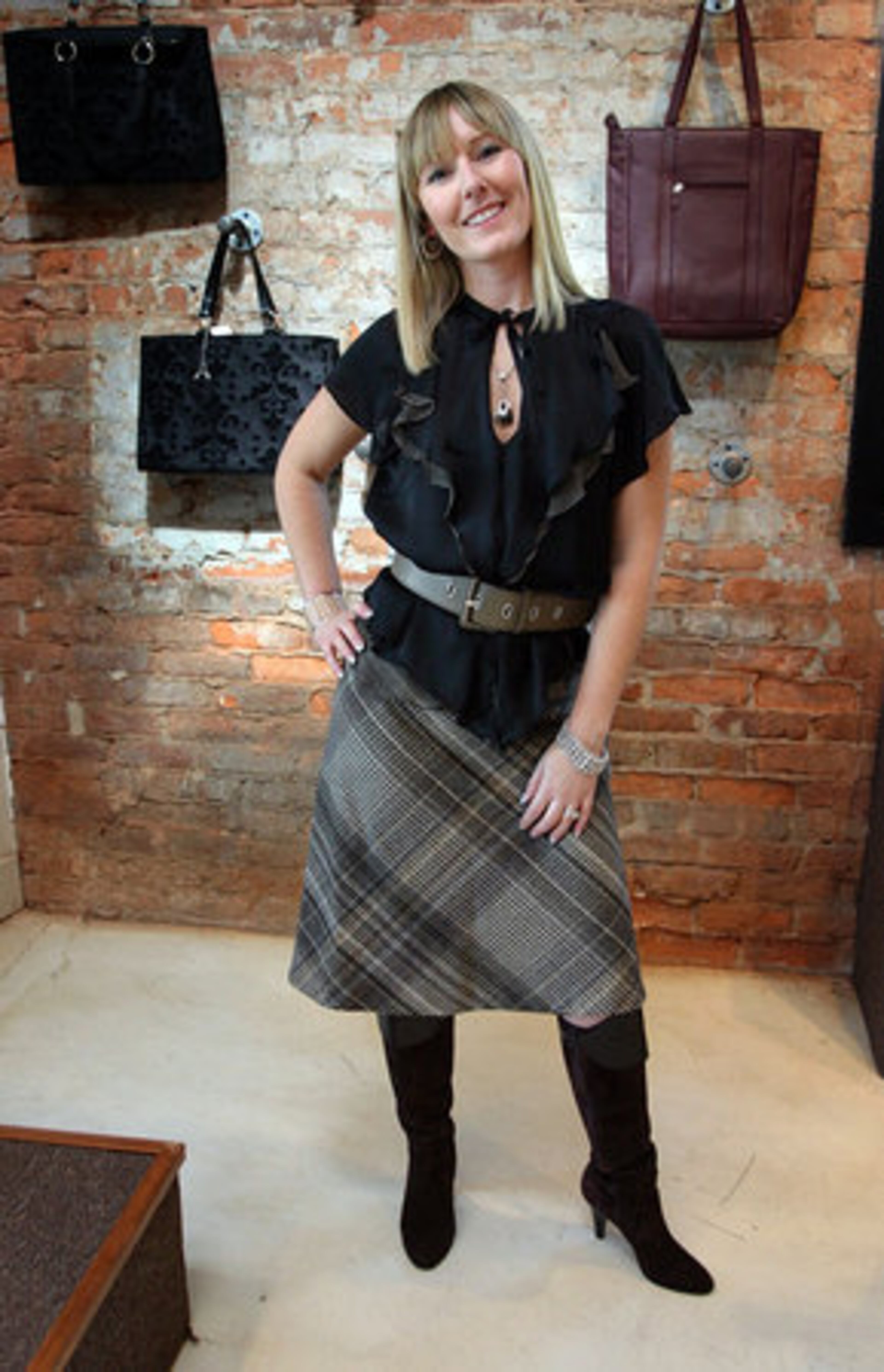 WHAT SHE'S WEARING: A top, belt and skirt from Zara and Italian boots by Max de Carlo.