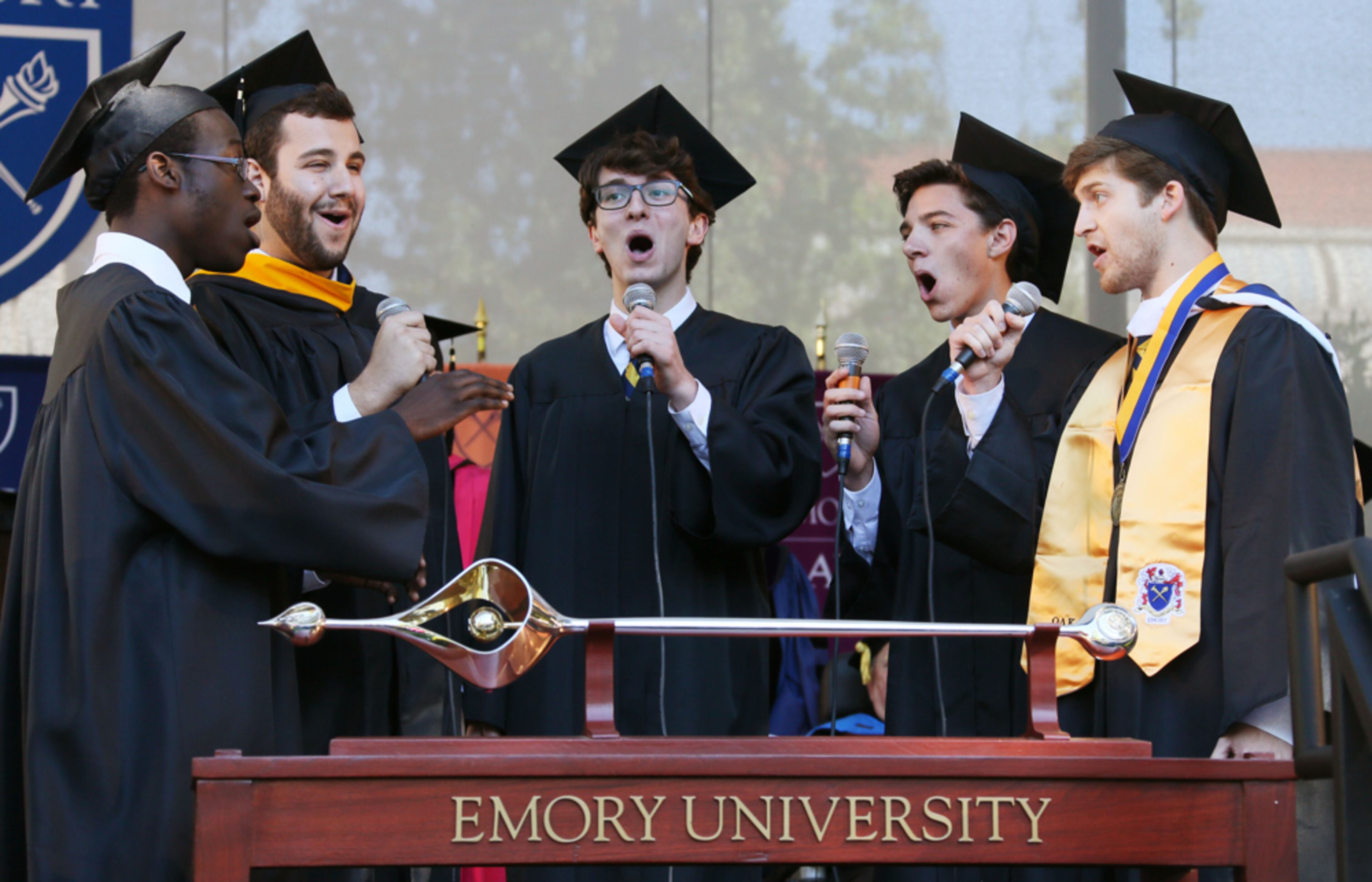 May 13, 2013 - Atlanta - UPDATED CAPTION - Five members of the group "No Strings Attached" perform Emory's Alma Mater a cappella at the close of graduation. Former U.S. Poet Laureate and Pulitzer Prize-winner Rita Dove delivered the keynote address at Emory's 168th commencement on the Emory quadrangle for about 4,200 graduating students and their families. About 15,000 people were expected to attend. BOB ANDRES / BANDRES@AJC.COM
