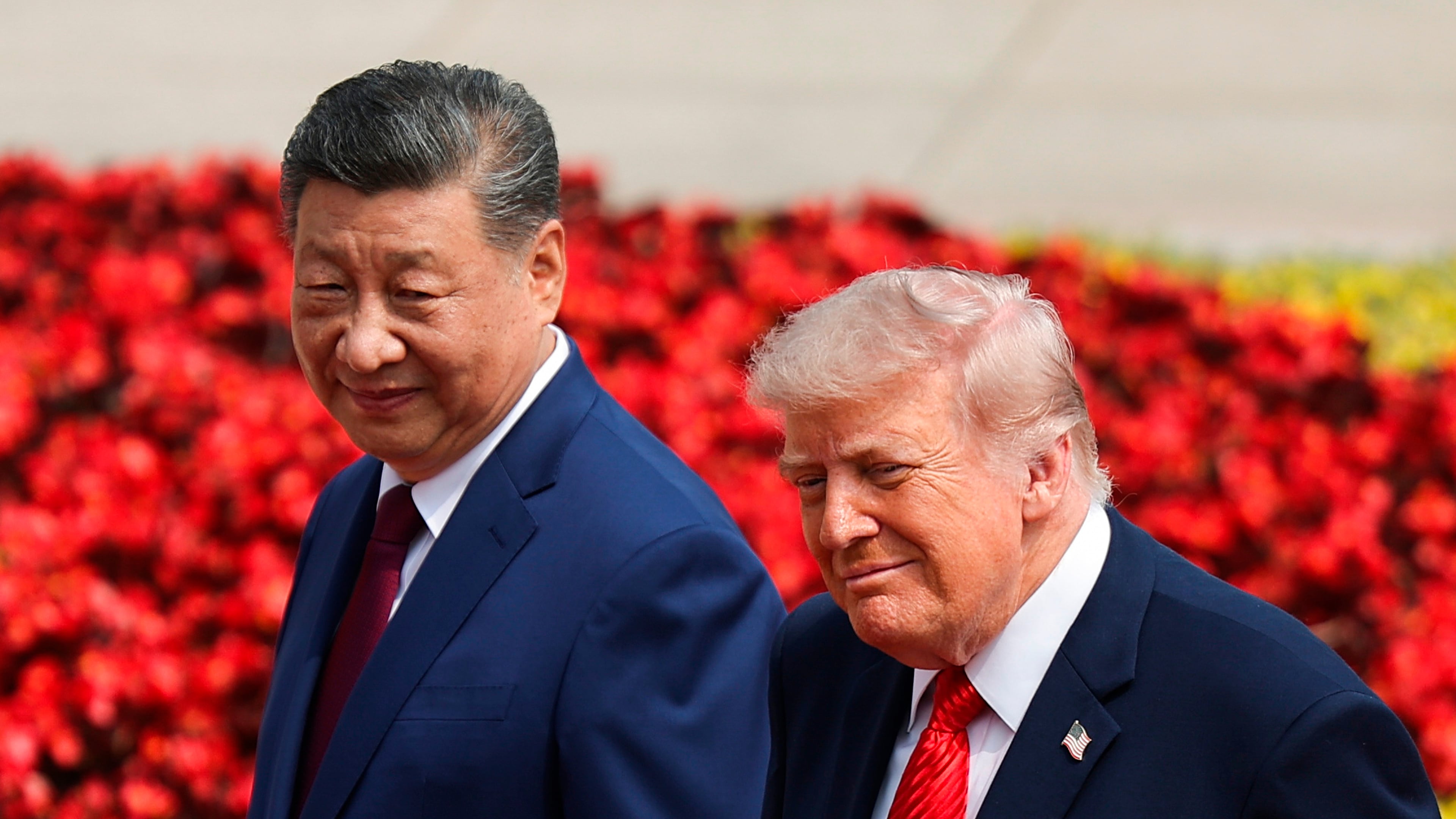 U.S. President Donald Trump, right, and Chinese President Xi Jinping attend a welcome ceremony at the Great Hall of the People in Beijing, Thursday, May 14, 2026. (Maxim Shemetov/Pool Photo via AP)
