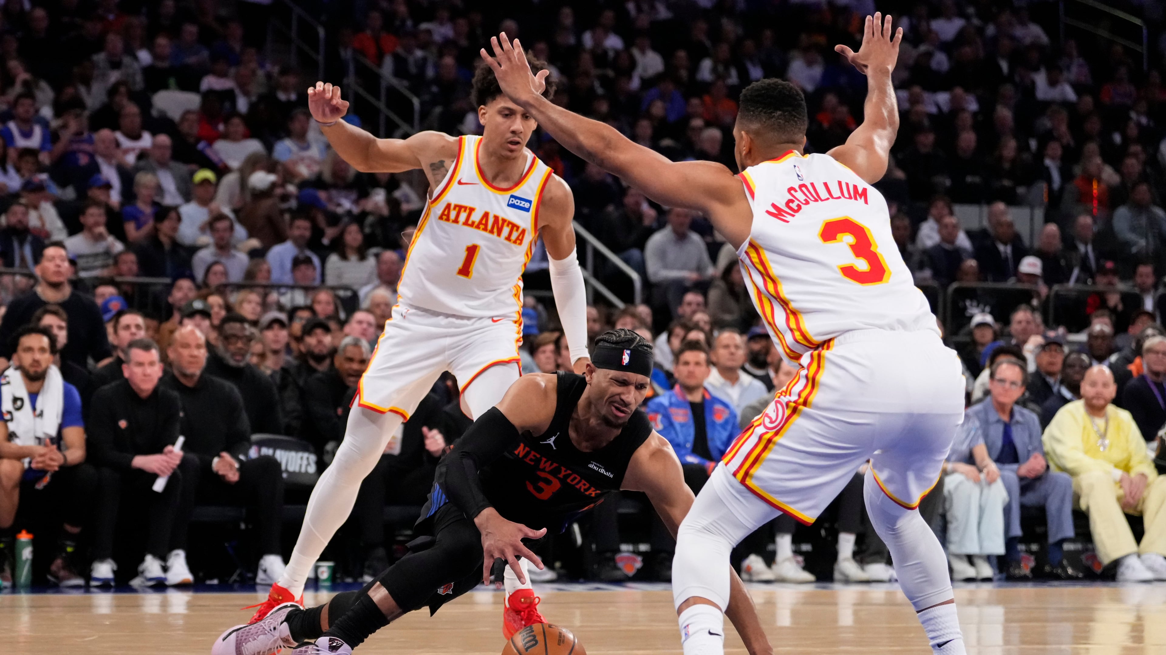 The Hawks’ defense, powered by Jalen Johnson (back) and CJ McCollum, picked up in the fourth quarter, allowing Atlanta to overcome a double-digit deficit in their Game 2 win over the Knicks on Monday, April 20, 2026, at Madison Square Garden in New York. (Yuki Iwamura/AP)