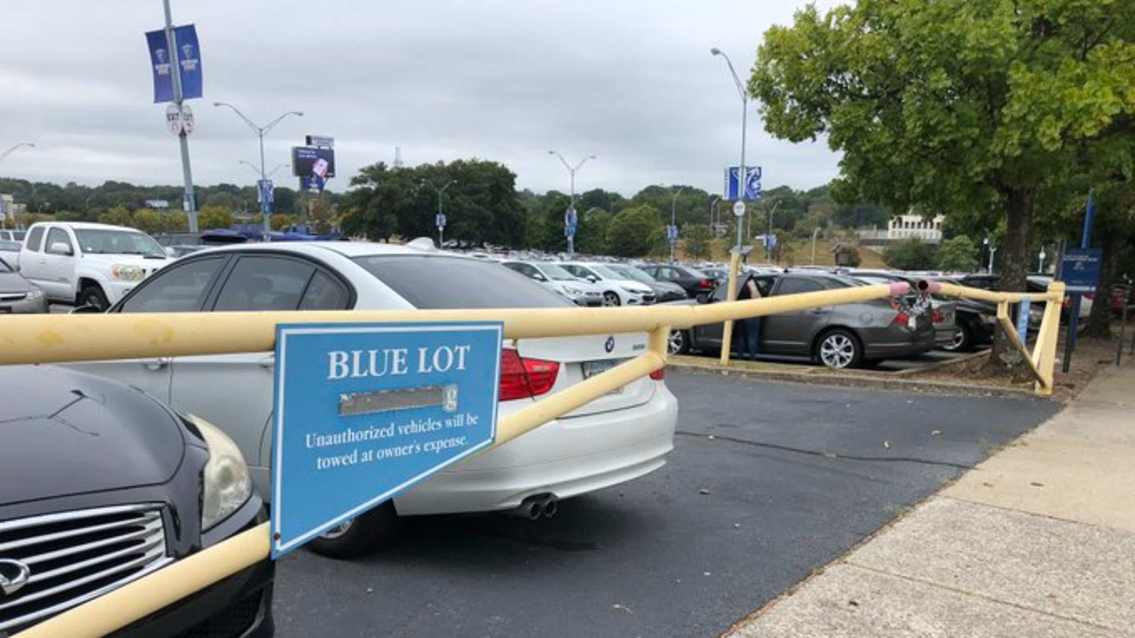 After the woman got into the driver’s seat of her car, two armed men jumped into the vehicle and demanded she hand over all of her belongings.