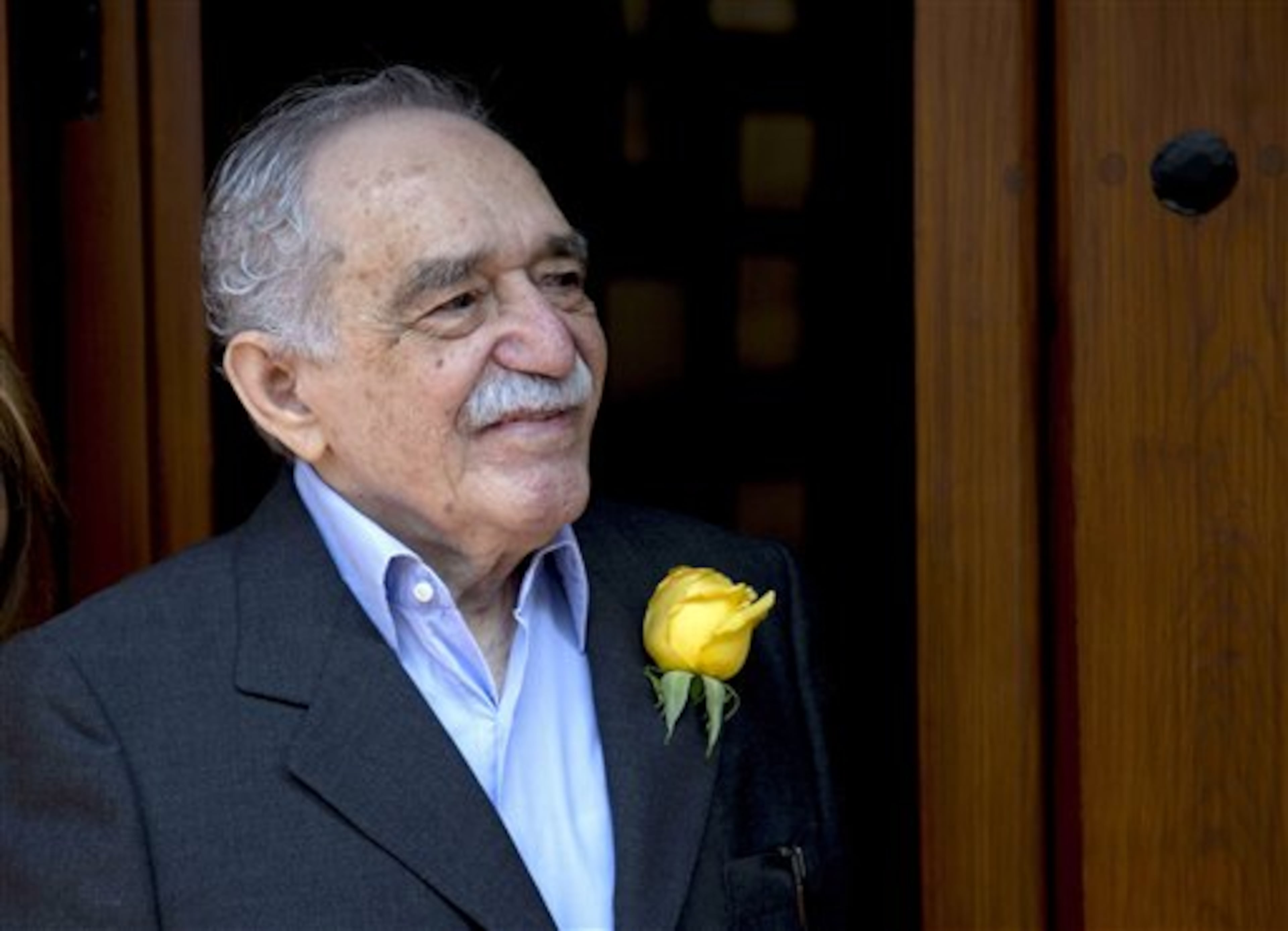 In this March 6, 2014 photo, Colombian Nobel Literature laureate Gabriel Garcia Marquez greets fans and reporters outside his home on his 87th birthday in Mexico City. Garcia Marquez died Thursday April 17, 2014 at his home in Mexico City. The author's magical realist novels and short stories exposed tens of millions of readers to Latin America's passion, superstition, violence and inequality. (AP Photo/Eduardo Verdugo)