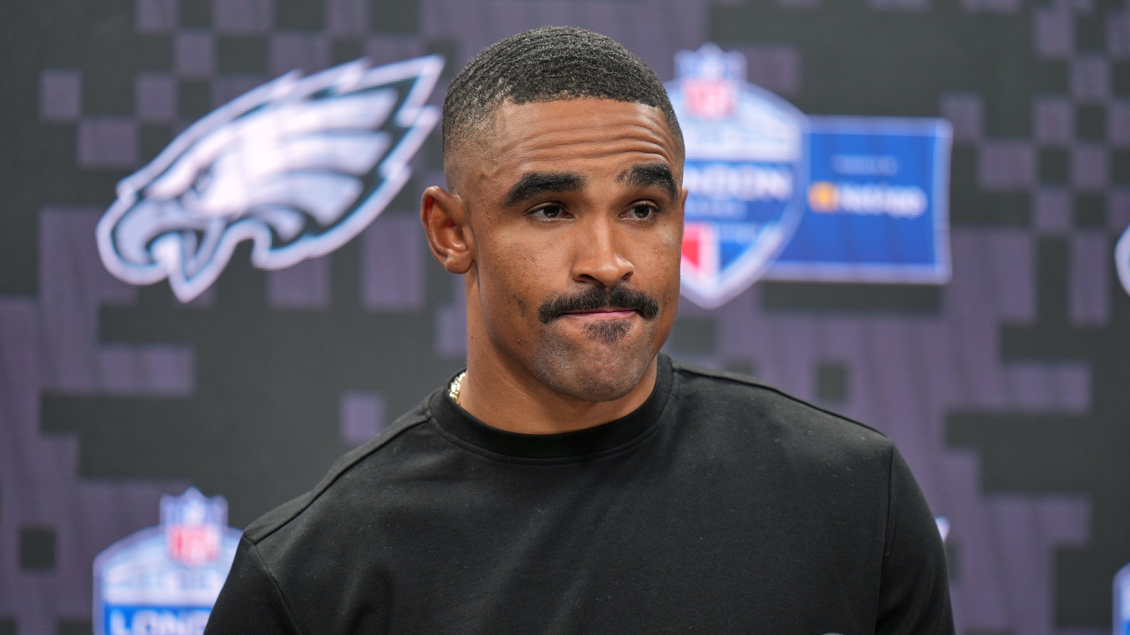 Philadelphia Eagles quarterback Jalen Hurts (1) attends a press conference after an NFL football game against Jacksonville Jaguars in London, Sunday, Oct. 11, 2026. (AP Photo/Alastair Grant)