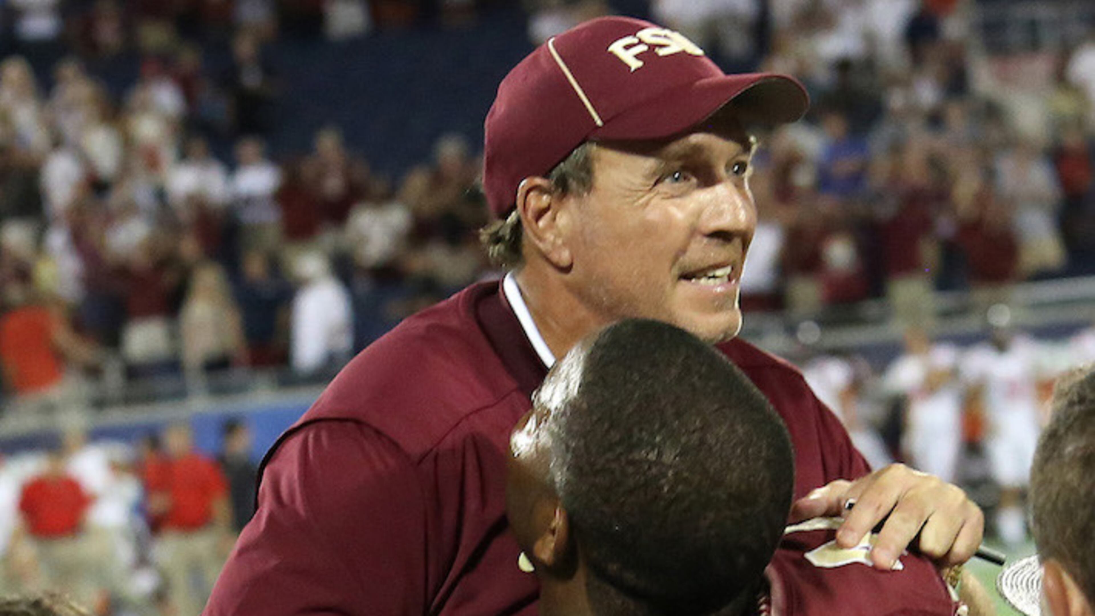 Florida State's Demarcus Walker picks up coach Jimbo Fisher in the final seconds as Florida State defeated Ole Miss on September 5, 2016, at Camping World Stadium, in Orlando, Fla. (Joe Burbank/Orlando Sentinel/TNS)