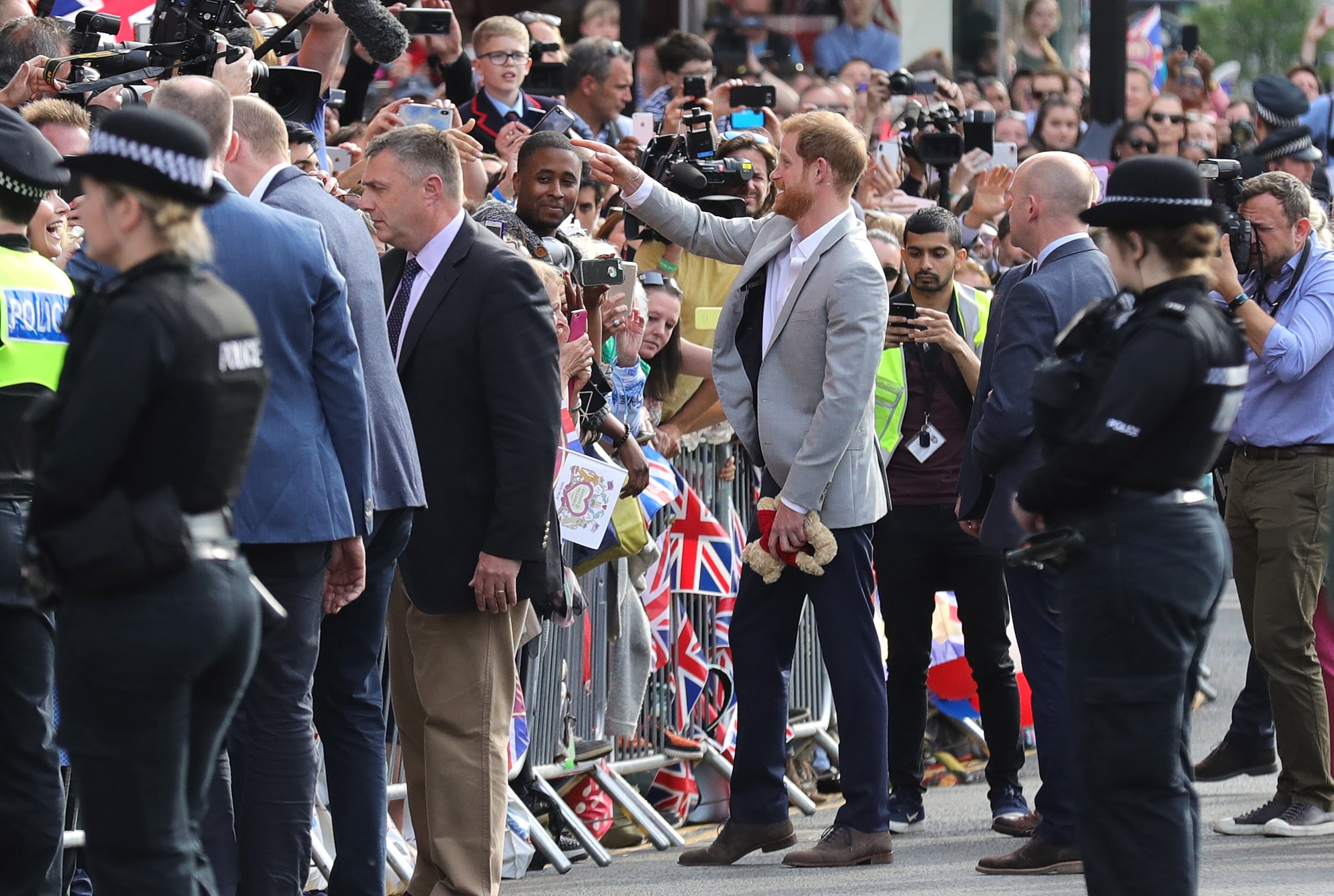 WINDSOR, ENGLAND - MAY 18: Prince Harry greets members of the public as he embarks on a walkabout ahead of the royal wedding of Prince Harry and Meghan Markle on May 18, 2018 in Windsor, England. (Photo by Chris Furlong/Getty Images)