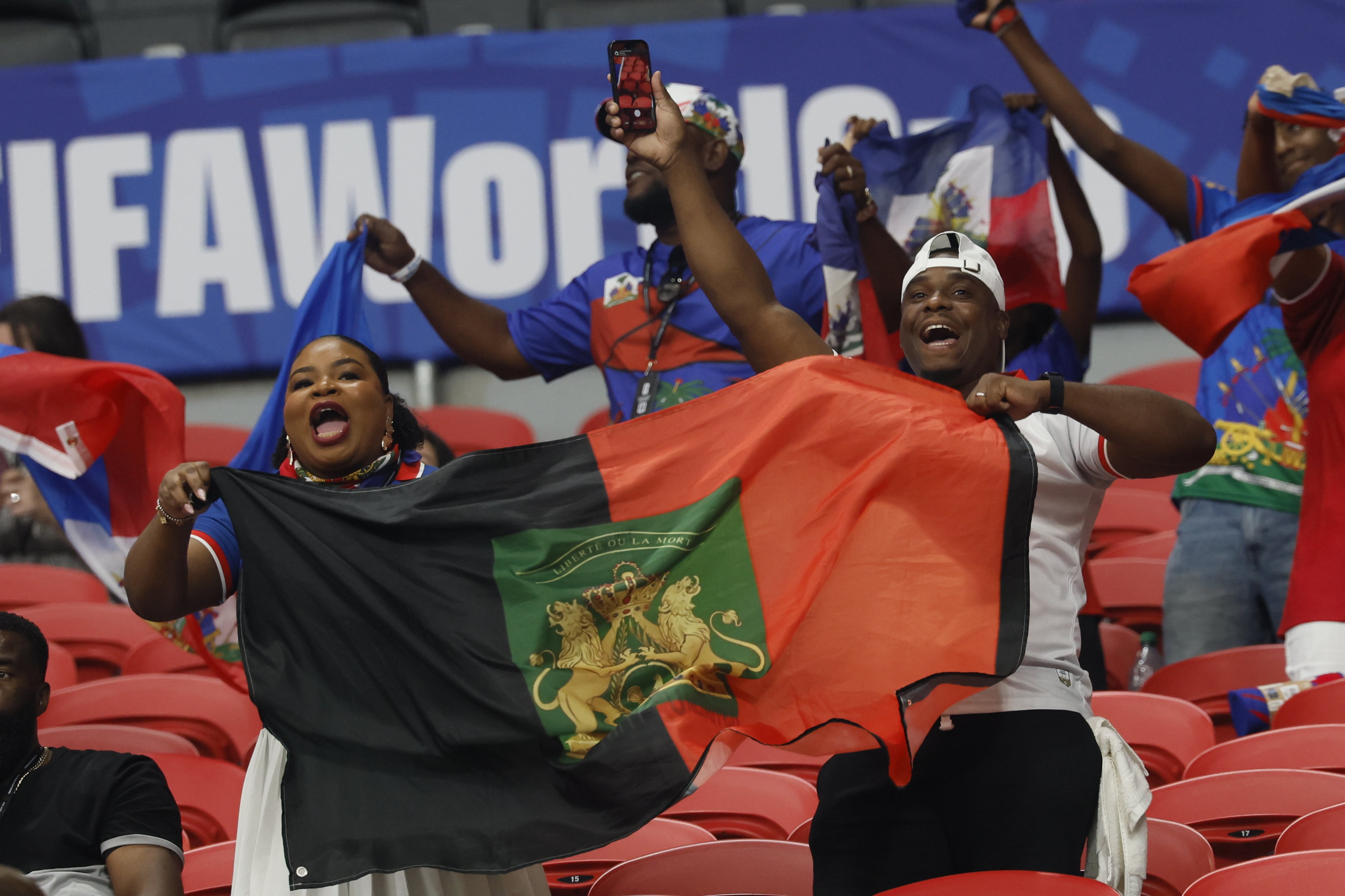 Haiti supporters cheer as their team enters the pitch for warm-ups before the start of the Morocco vs. Haiti Group C FIFA World Cup match at Atlanta Stadium (Mercedes-Benz Stadium) on Wednesday, June 24, 2026. (Miguel Martinez/AJC)