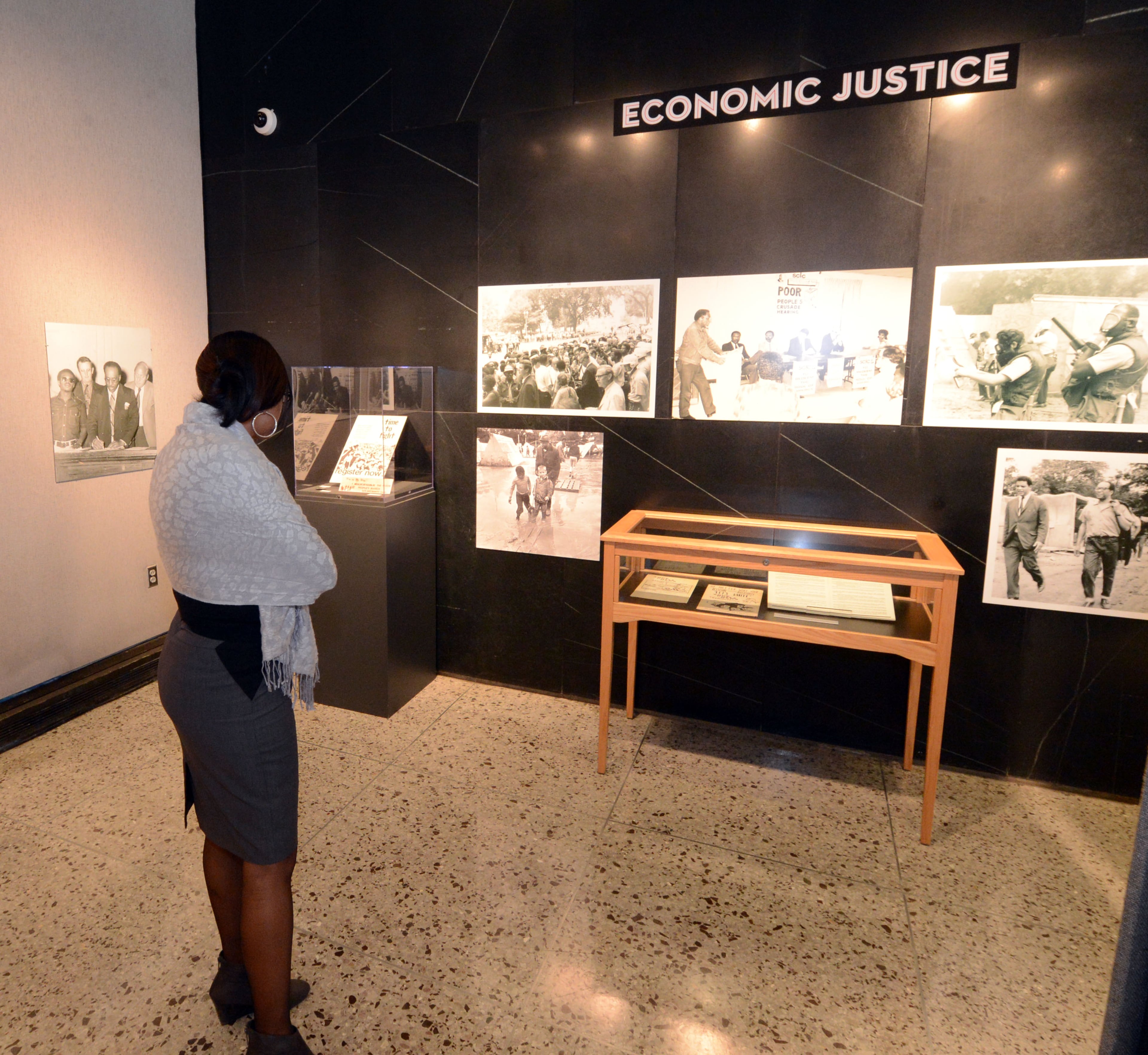 Emory staffer Nydia Huggins looks over the exhibit during a preview on Wednesday, Feb 20, 2013.