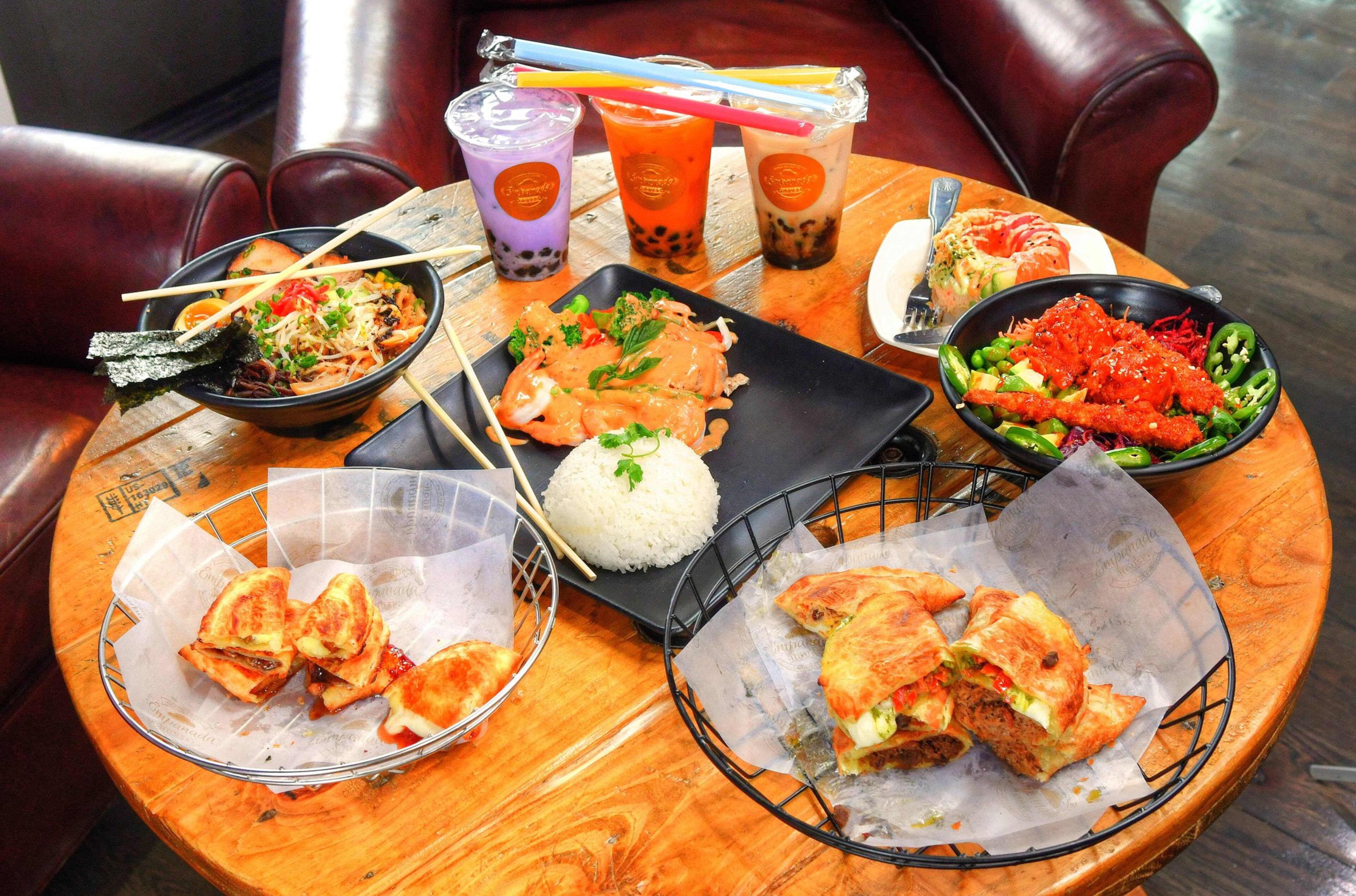 A few of the offerings available at Sweet Octopus (Clockwise from bottom right): Empanadas from Empanada House, Sweet Empanadas from Empanada House, Village Classic from Lifting Noodles Ramen, Taro, Thai Tea and Brown Sugar Bubble Teas from Empanada House, Donut from Poke Burri, Dynamite Bowl from Poke Burri and Red Curry Chicken and Shrimp (Thai Food). CONTRIBUTED BY CHRIS HUNT PHOTOGRAPHY