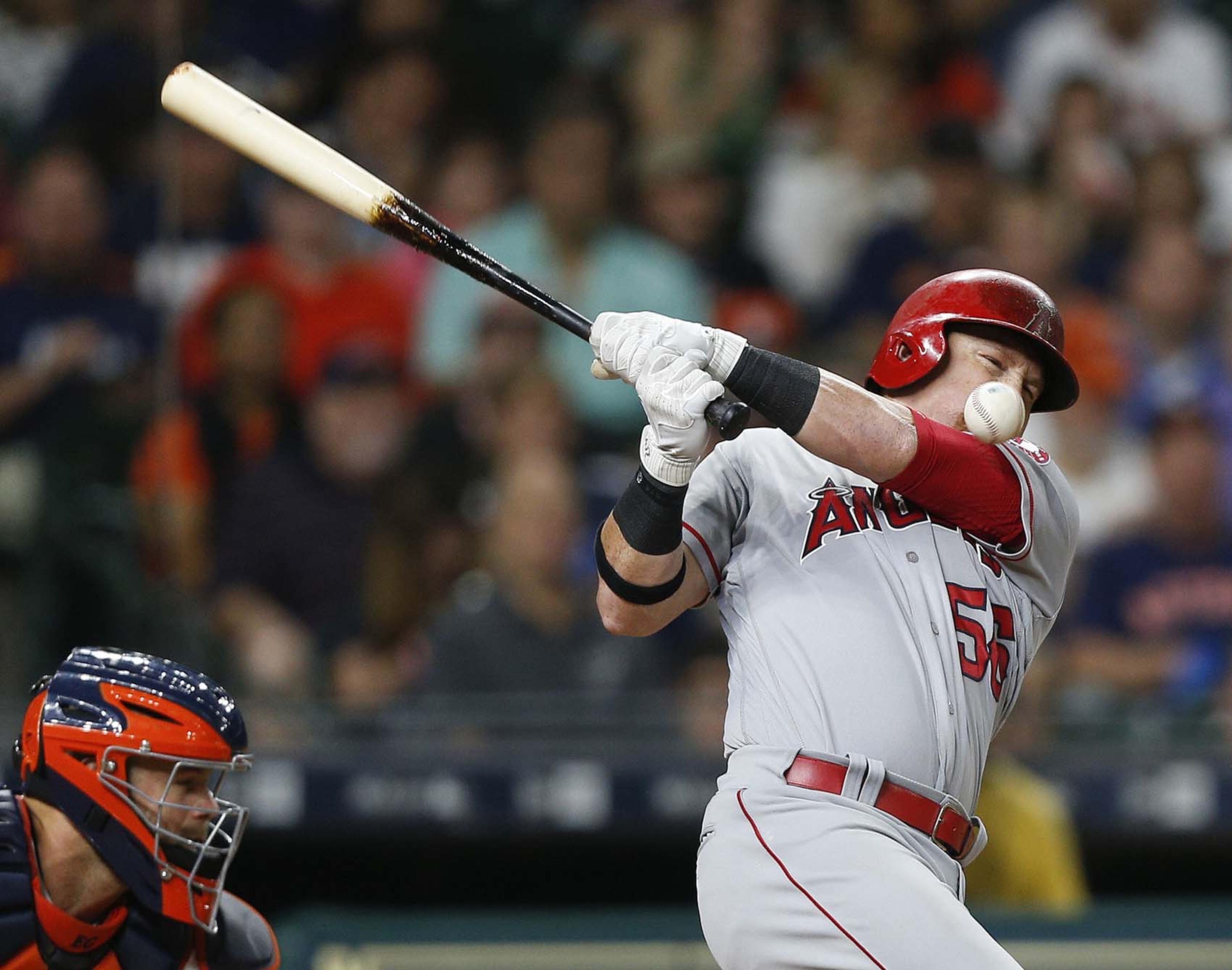 HOUSTON, TX - APRIL 17: Kole Calhoun #56 of the Los Angeles Angels of Anaheim fouls the ball off his face against the Houston Astros at Minute Maid Park on April 17, 2017 in Houston, Texas. (Photo by Bob Levey/Getty Images) ***BESTPIX***