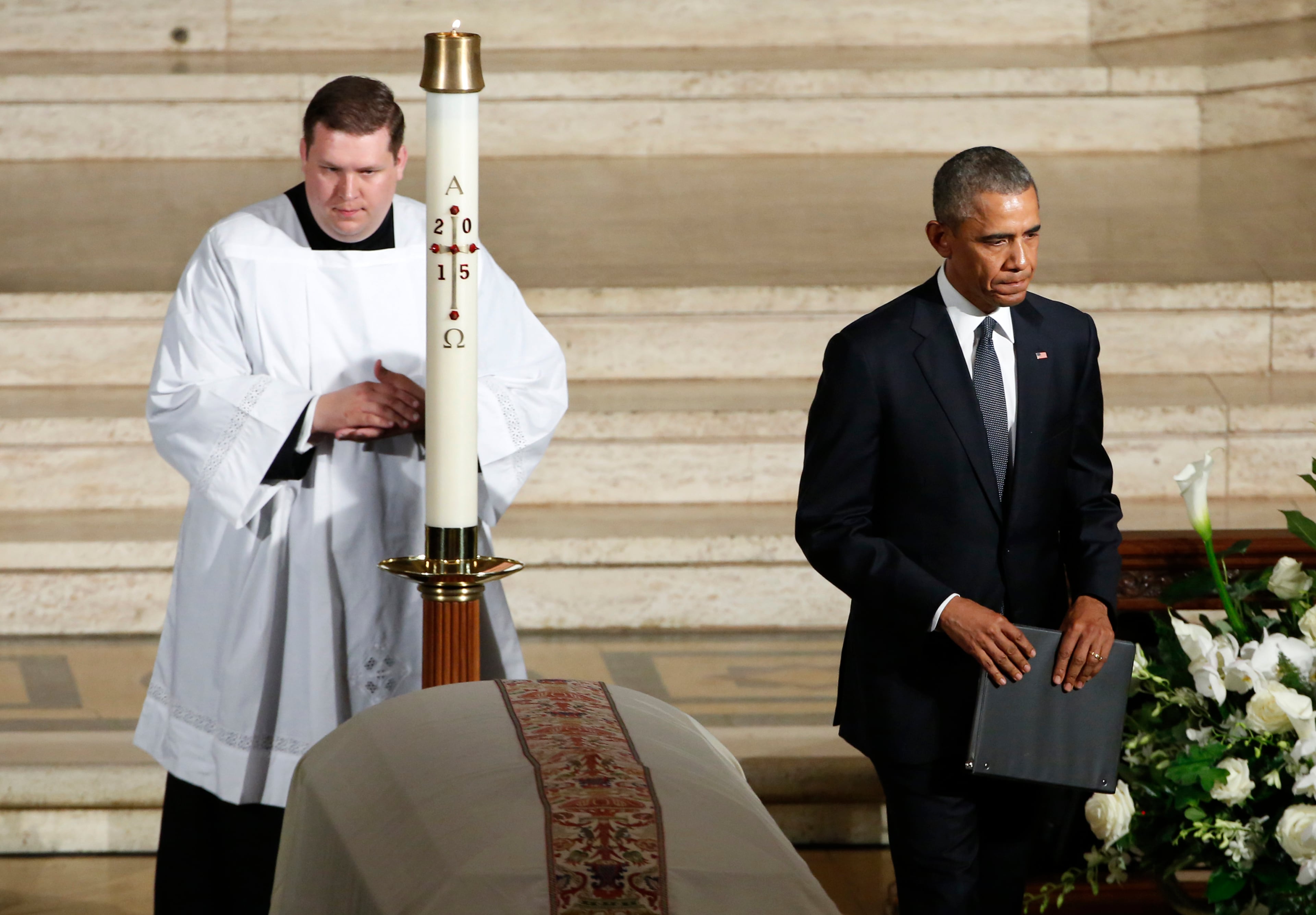 President Barack Obama leaves after delivering the eulogy during funeral services for Vice President Joe Biden's son, Beau Biden, Saturday, June 6, 2015, at St. Anthony of Padua Church in Wilmington, Del. (Yuri Gripas/Pool Photo via AP)