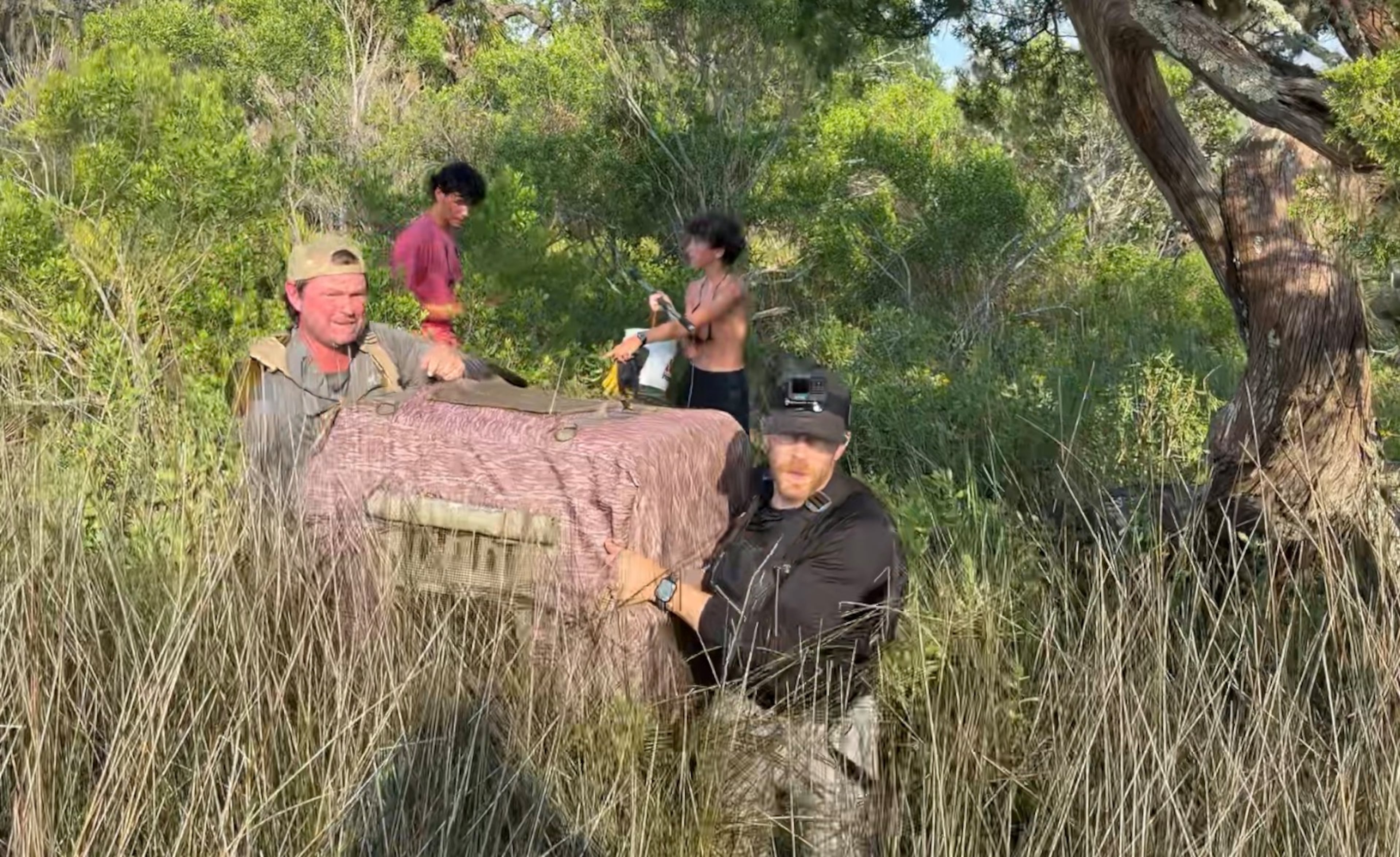 A rescue crew carries Walker in a dog crate from where he was found on Little Tybee Island. The 2-year-old hound spent six days on the uninhabited island after fleeing a house fire. (Photo courtesy of Bryan Donaldson)