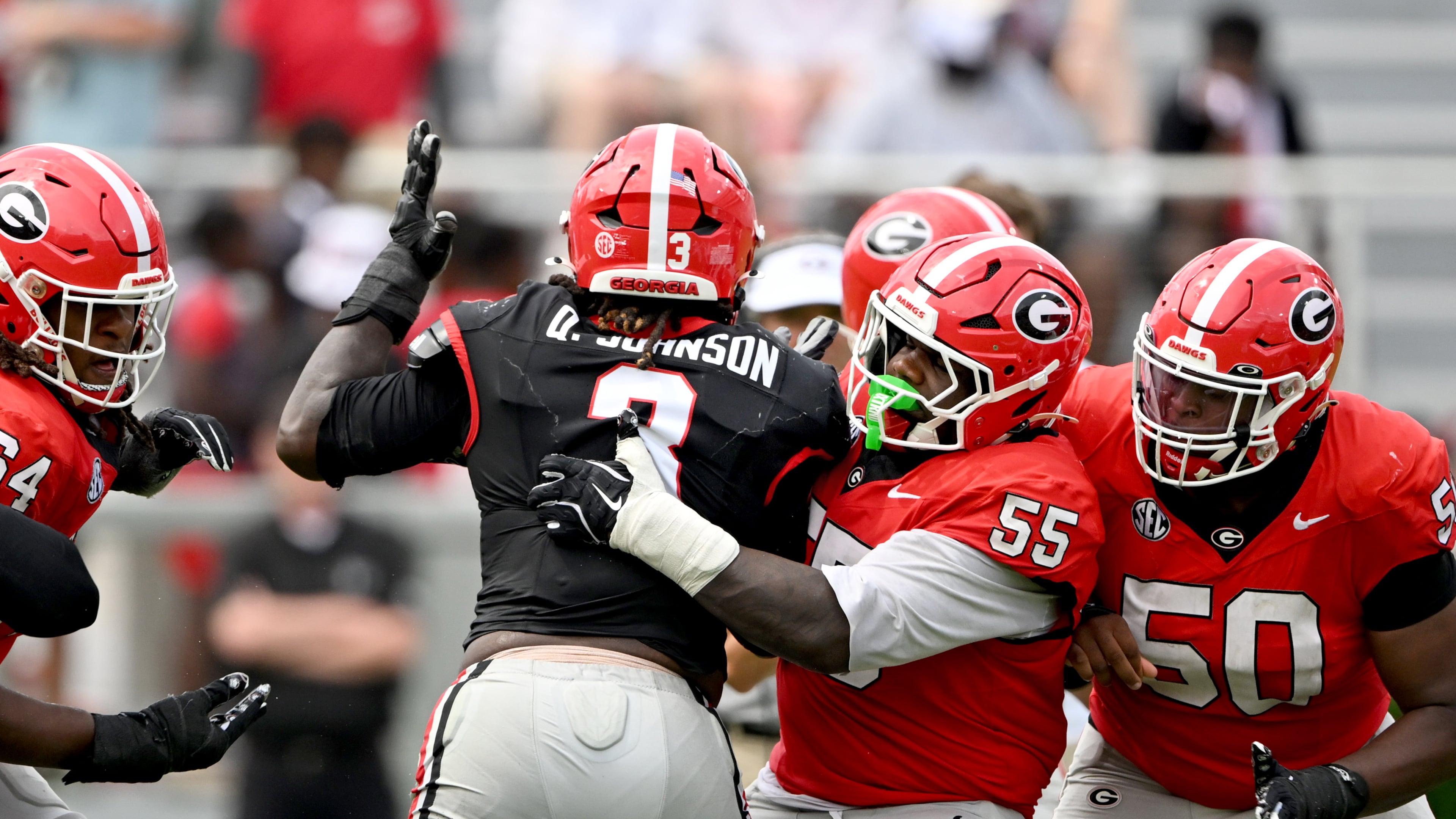 Georgia center Zykie Helton (55) blocks Georgia Quintavius Johnson (3) during 2026 G-Day spring football game at Sanford Stadium, Saturday, April 18, 2026, in Athens. (Hyosub Shin/AJC)