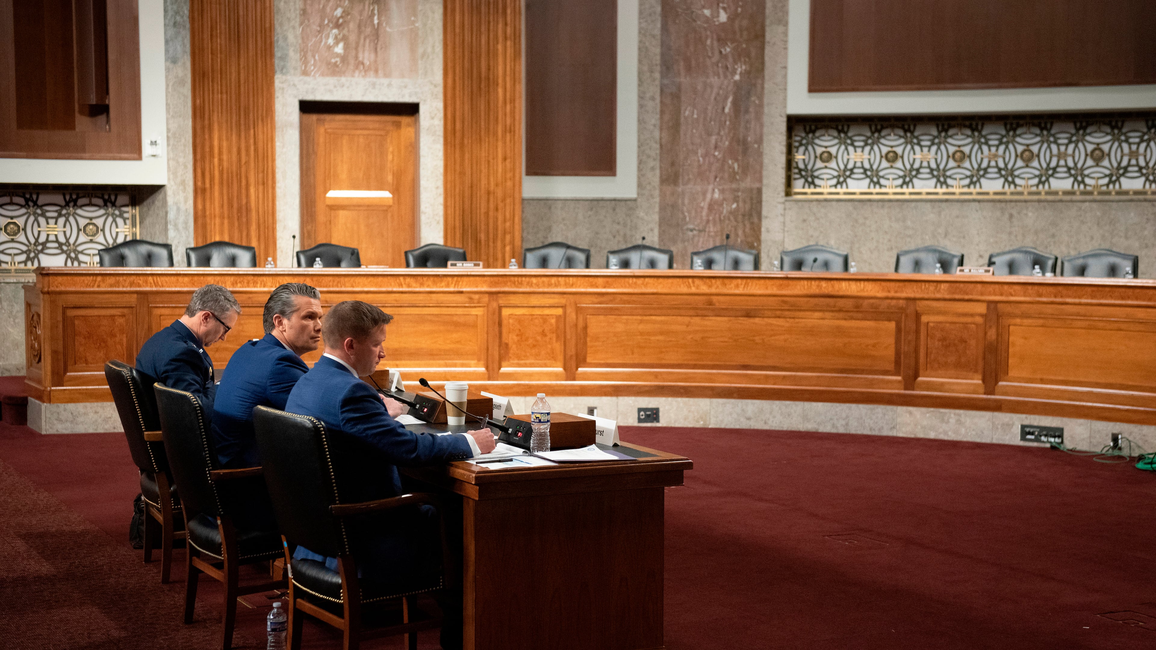 From l-r., Chairman of the Joint Chiefs of Staff Air Force Gen. Danial Caine, Secretary of Defense Pete Hegseth, and acting undersecretary of defense during the Senate Armed Services Committee hearing on the Department of Defense budget, on Capitol Hill, in Washington, Thursday, April 30, 2026. (AP Photo/Cliff Owen)