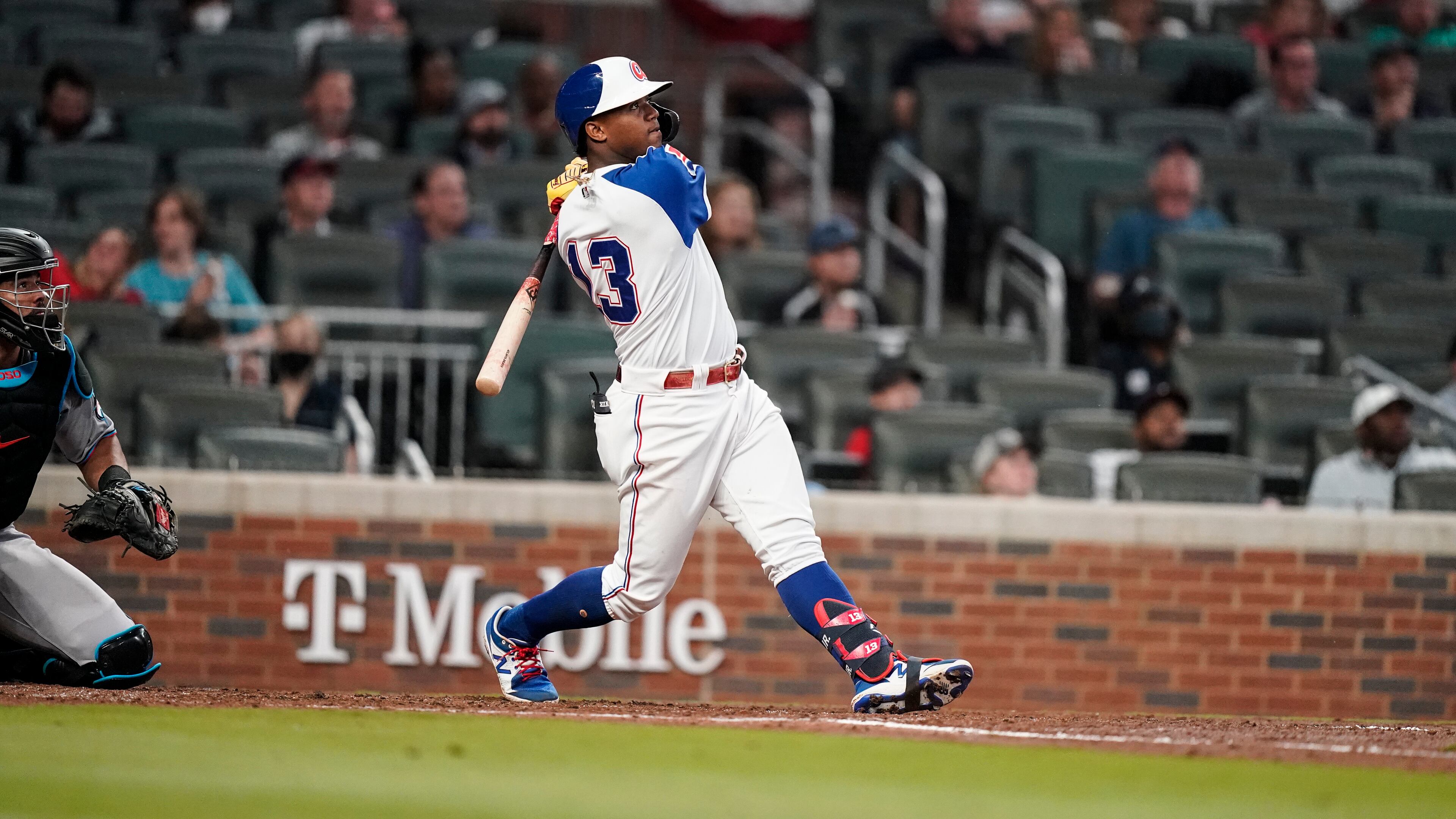 Atlanta Braves' Ronald Acuna Jr., hits a home run in the third inning of a baseball game against the Miami Marlins Wednesday, April 14, 2021, in Atlanta. (AP Photo/Brynn Anderson)