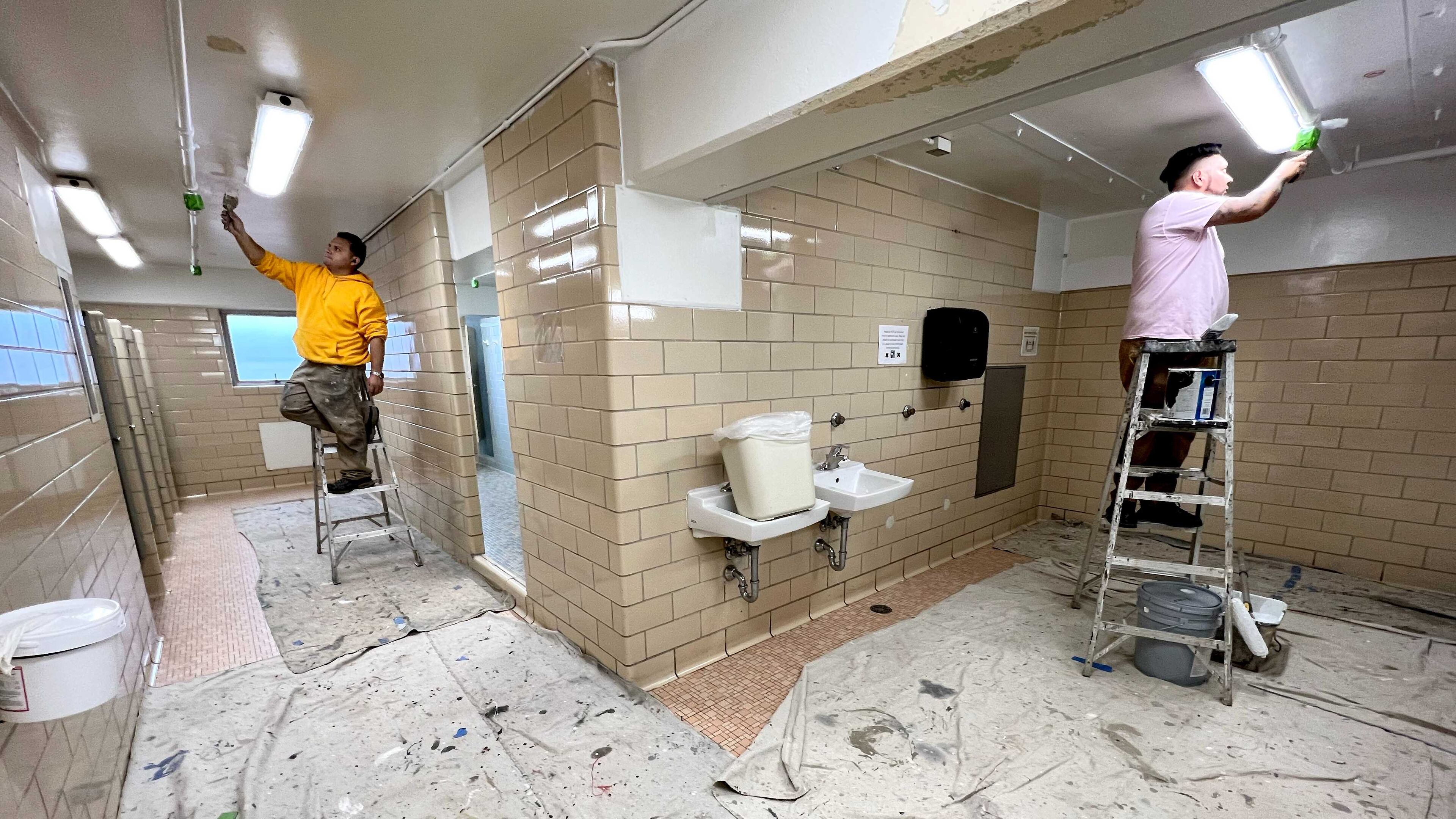 Crews work to scrape, prime and paint ceilings with mold-inhibiting scrubbable paint at Mell Hall at the University of Georgia. (Courtesy of University of Georgia)