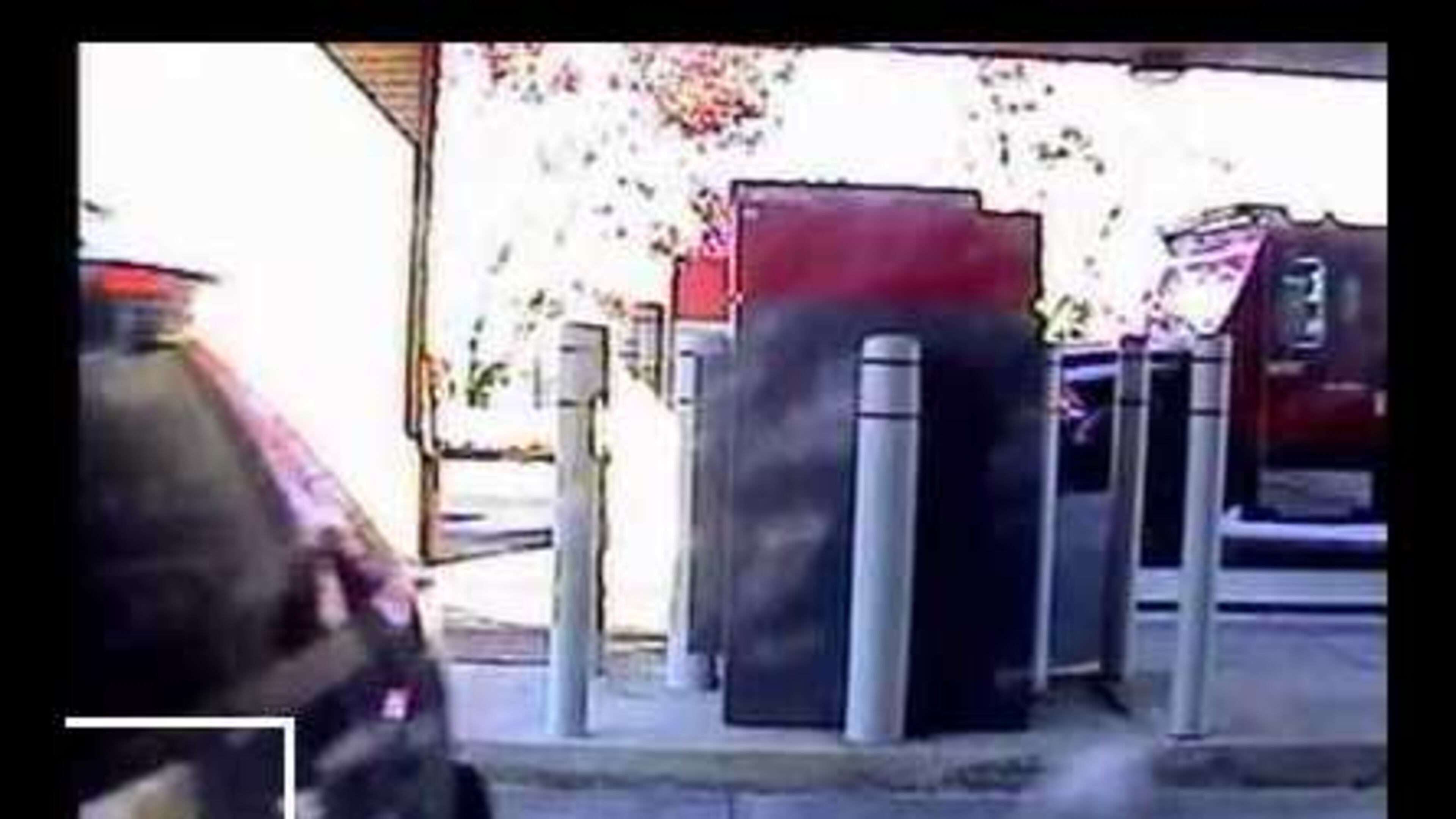 The FBI thinks someone might recognize the car and bumper sticker shown in this security photo from an armored car robbery in DeKalb County.