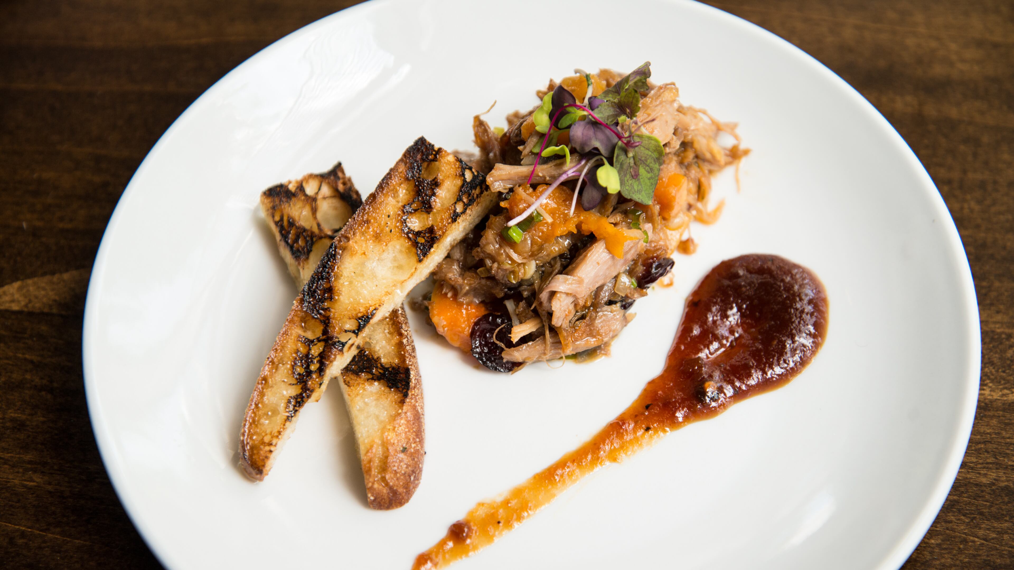 From @ajcdining: Korean pulled duck confit with crostini from @theconsulateatl.