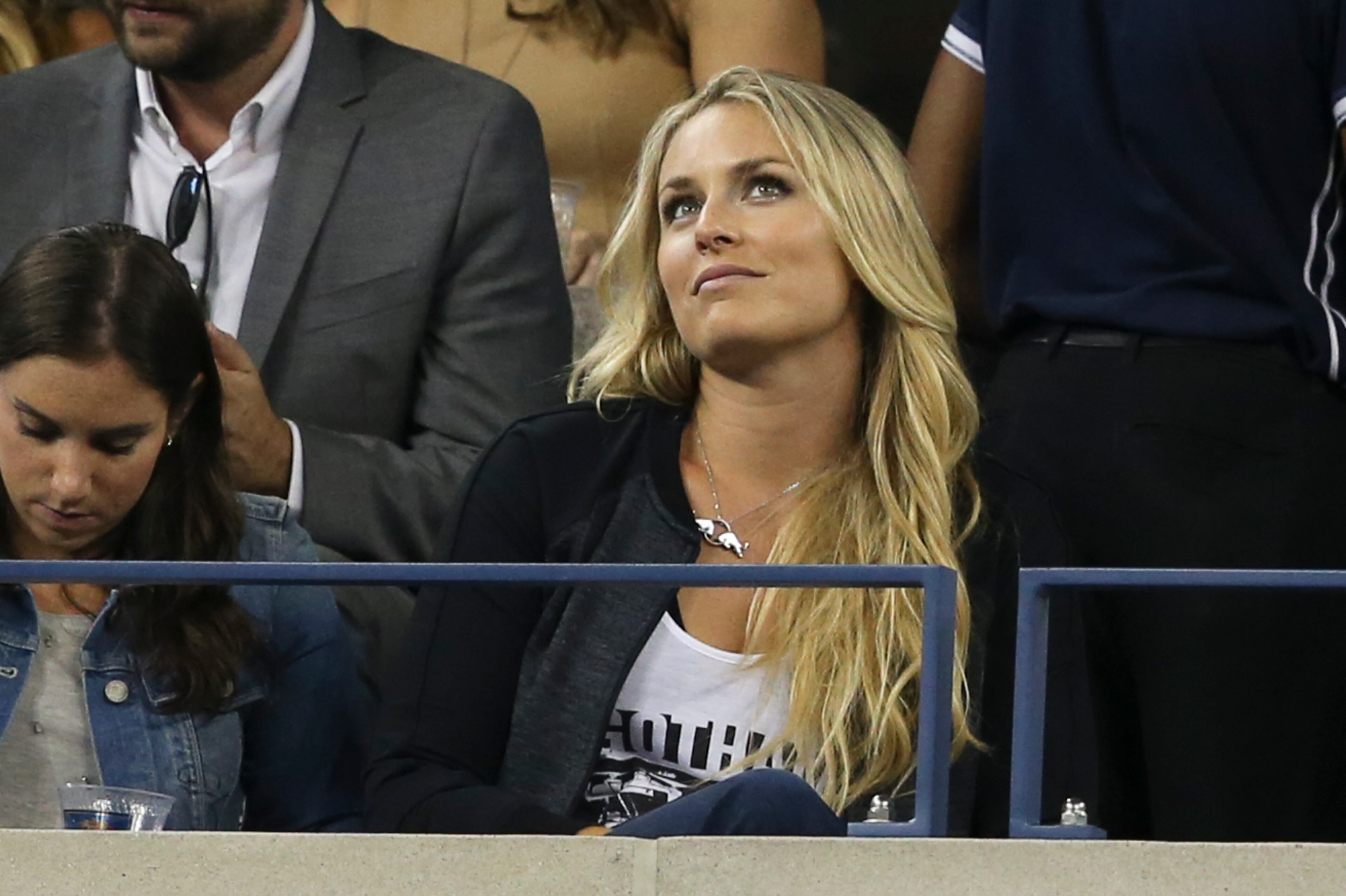 Skier Lindsey Vonn attends the quarterfinal match between Roger Federer, of Switzerland, and Gael Monfils, of France, at the U.S. Open tennis tournament, Thursday, Sept. 4, 2014, in New York. (AP Photo/John Minchillo)