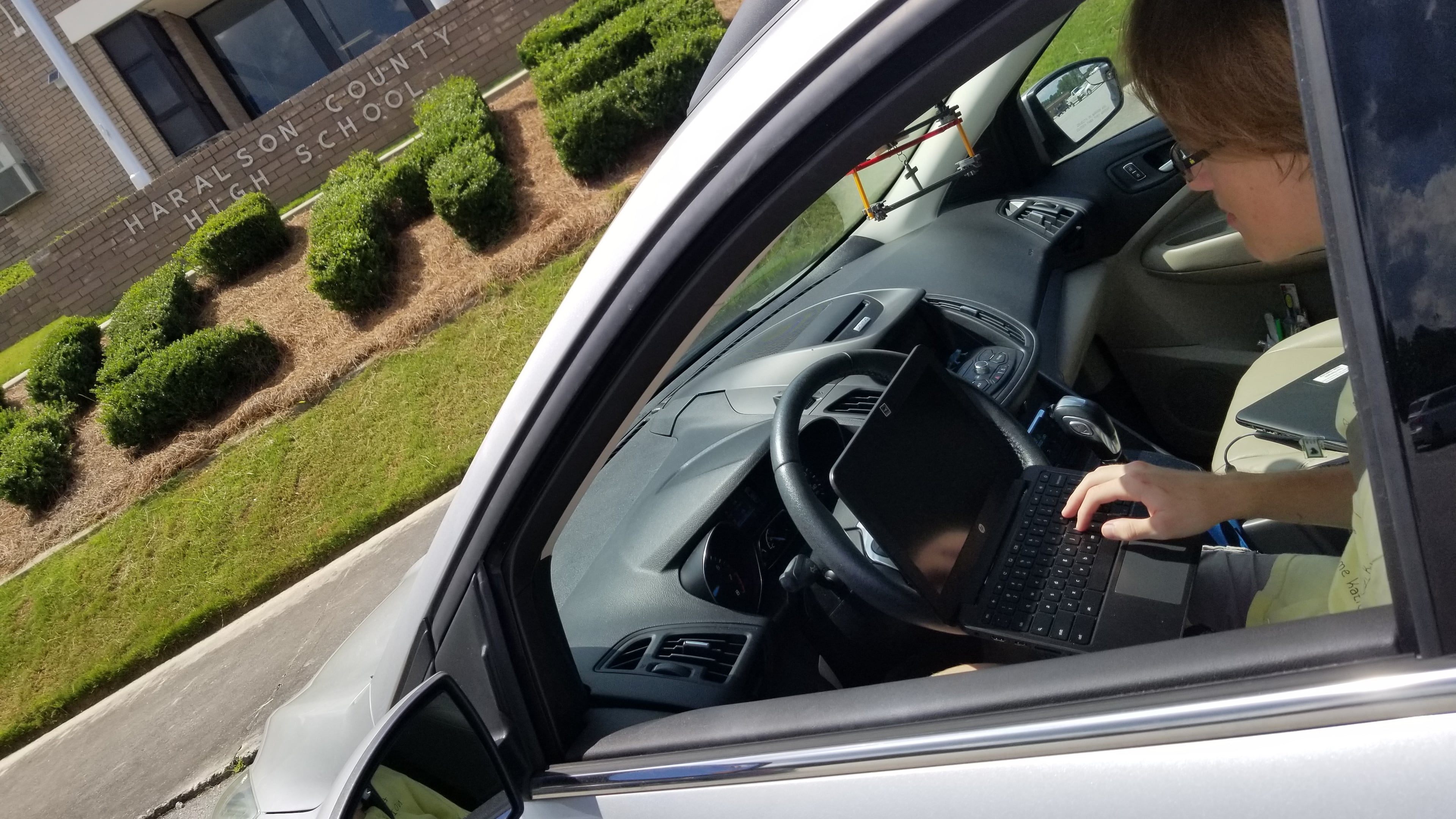 Haralson County High School student Tucker Cole drove onto campus to use the school Wi-Fi to complete his assignments during the school's shutdown in April. Contributed by Maegan Rutherford