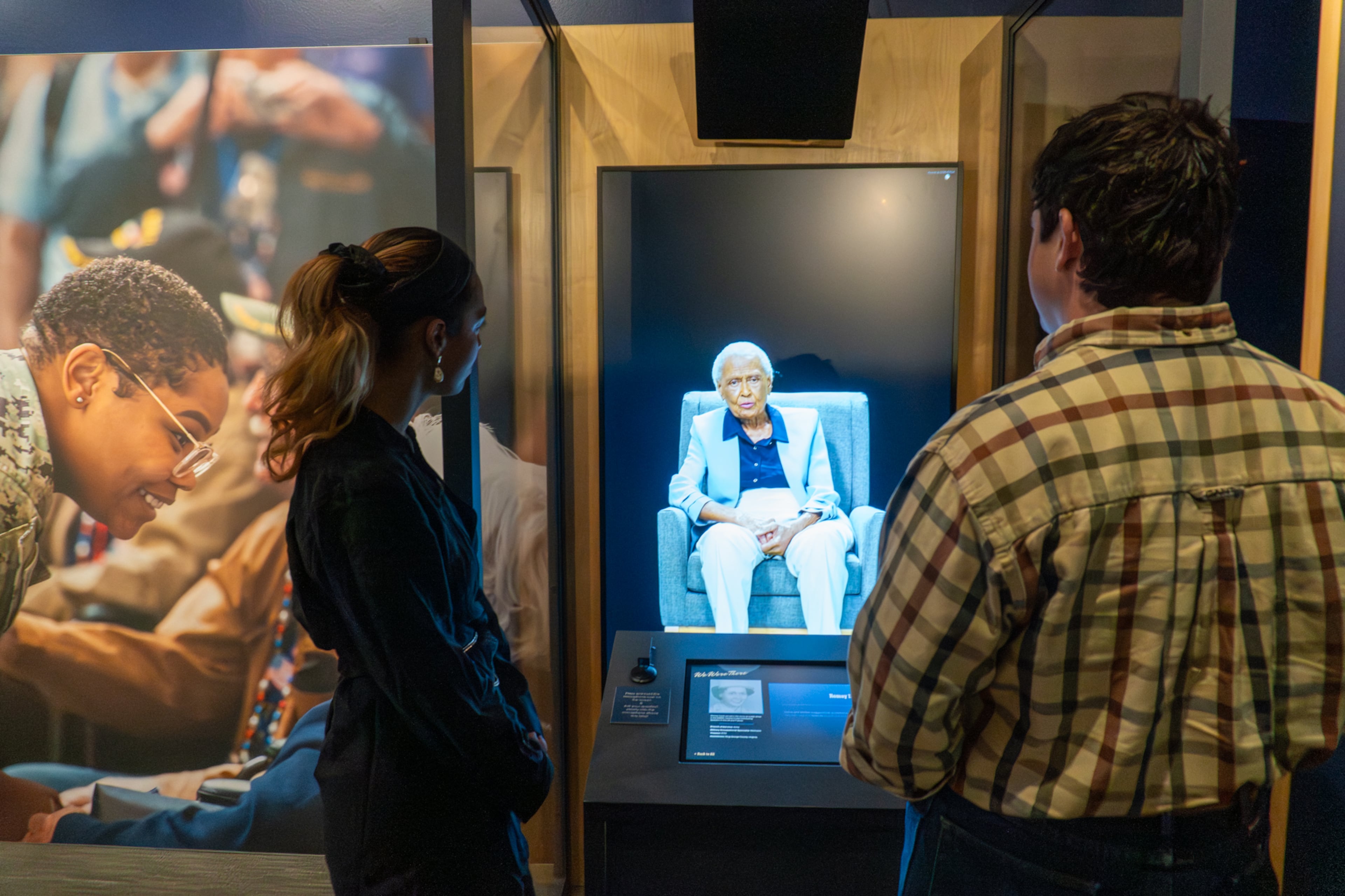 Visitors speak with an interactive AI video of a WWII veteran. The experience is part of "Our War Too: Women in Service." (Courtesy of Atlanta History Center)