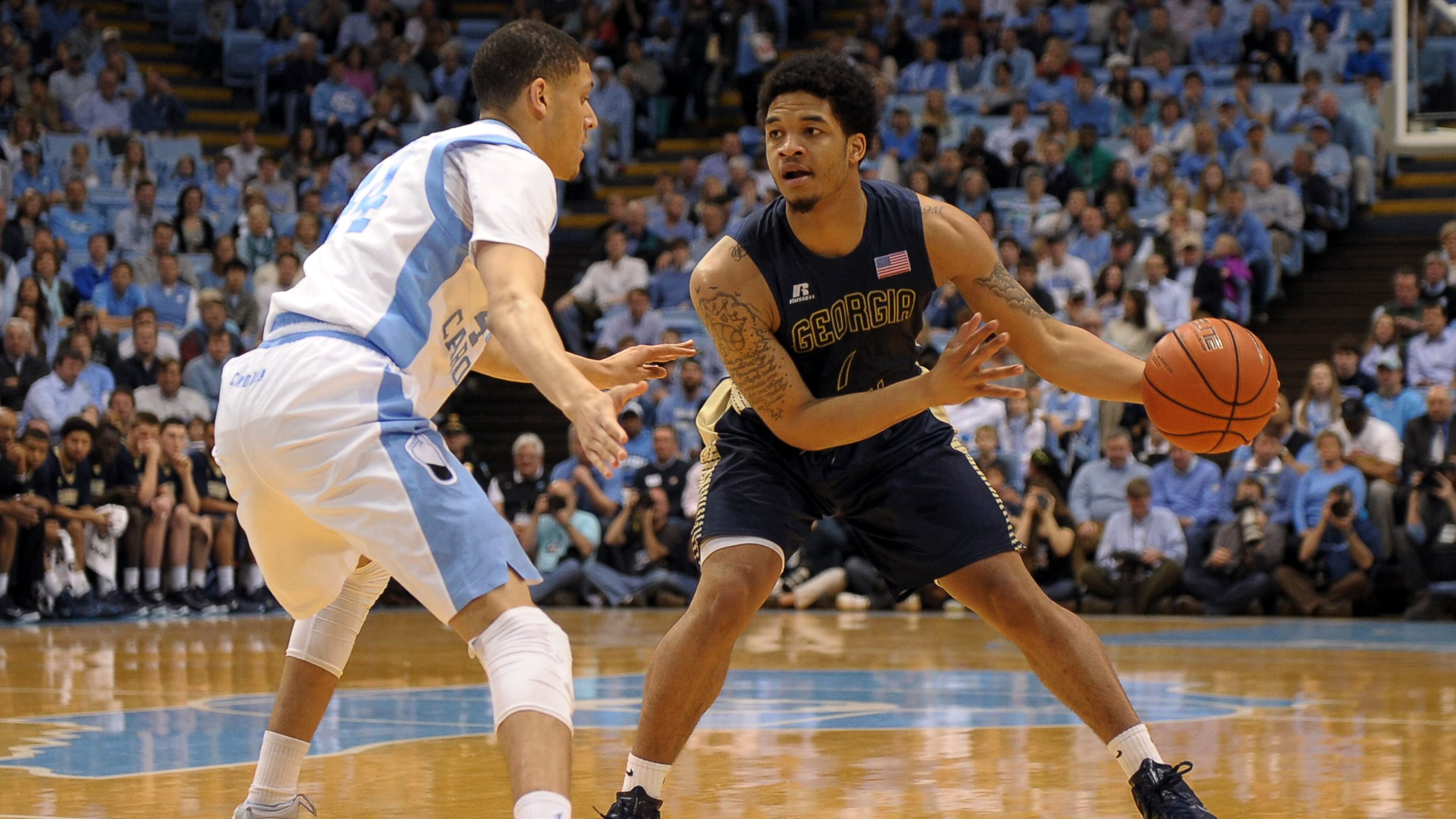 CHAPEL HILL, NC - FEBRUARY 21: Tadric Jackson #1 of the Georgia Tech Yellow Jackets dribbles against Justin Jackson #44 of the North Carolina Tar Heels at the Dean Smith Center on February 21, 2015 in Chapel Hill, North Carolina. (Photo by Lance King/Getty Images)