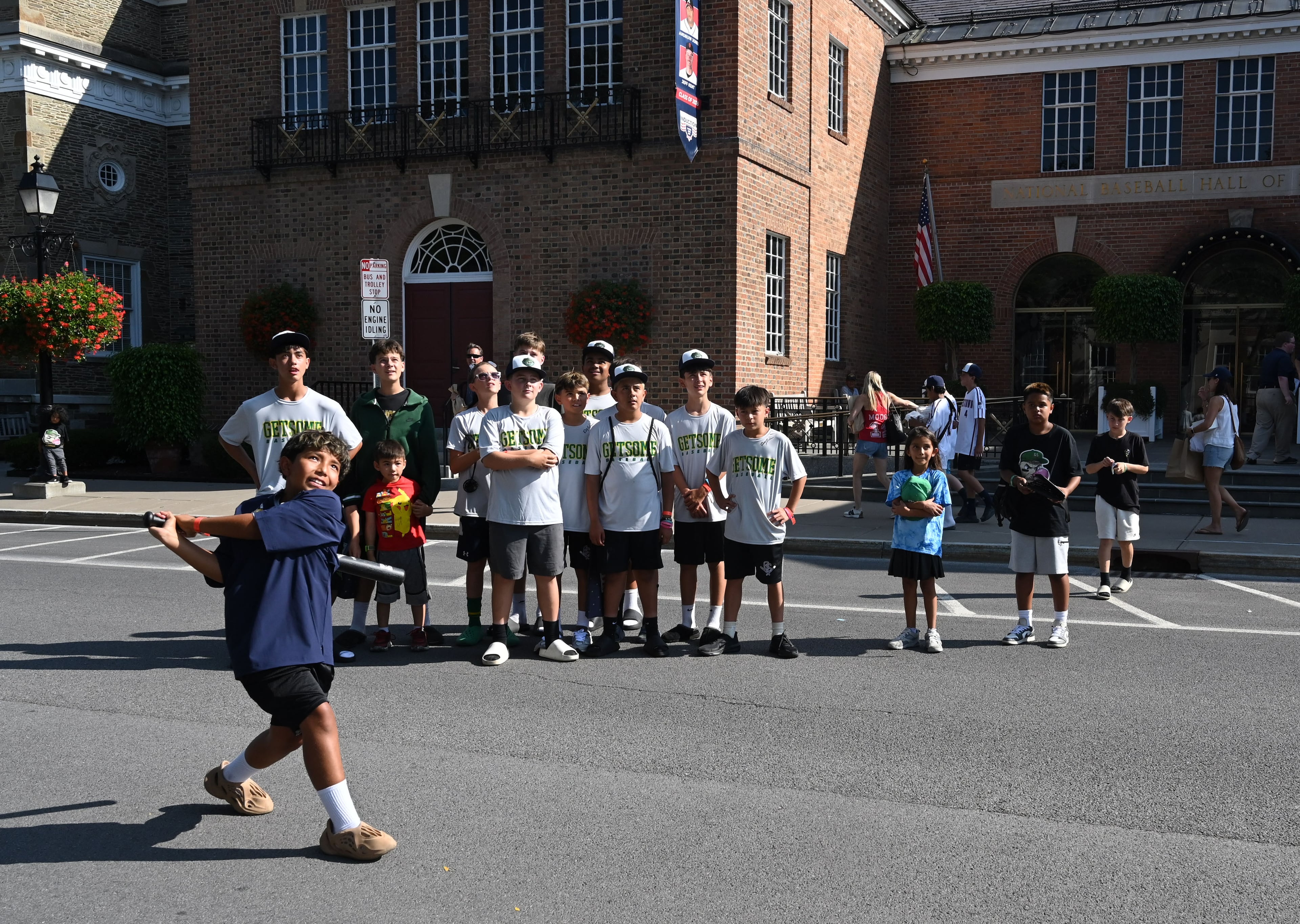 Young baseball fans play baseball outside the National Baseball Hall of Fame and Museum on Friday, July 24, 2026, in Cooperstown, N.Y. Andruw Jones is being inducted into the National Baseball Hall of Fame this Sunday as part of the Class of 2026, alongside Carlos Beltrán and Jeff Kent. He is recognized as one of the greatest center fielders in the league's history. Jones will become the 12th Braves player to be inducted into the Hall of Fame. (Hyosub Shin/AJC)