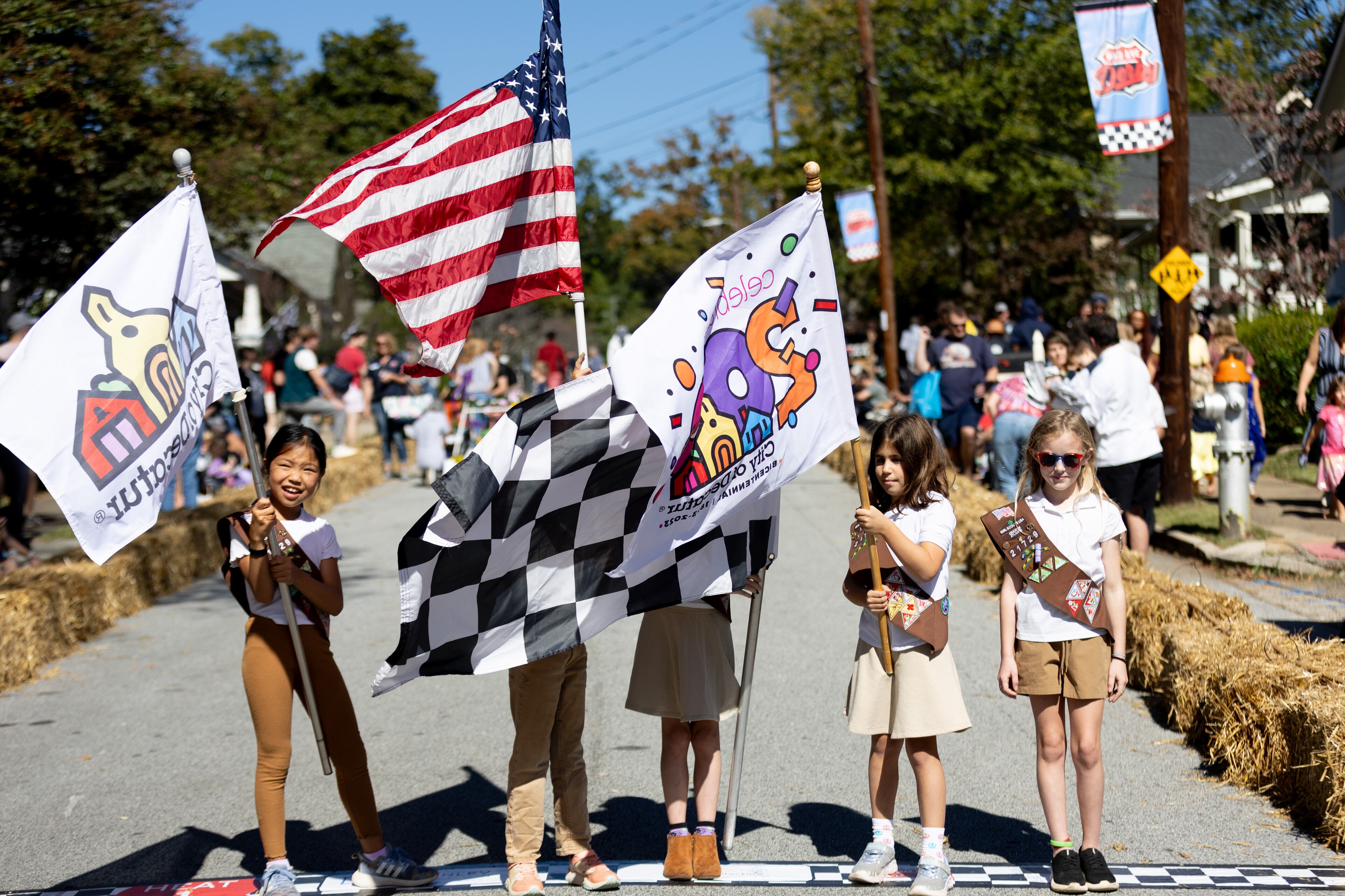 Girl Scout Troop 21729 helps with the National anthem before the start of the 12th Annual Madison Avenue Derby in Decatur on Saturday, Oct. 21, 2023. (Steve Schaefer/steve.schaefer@ajc.com)