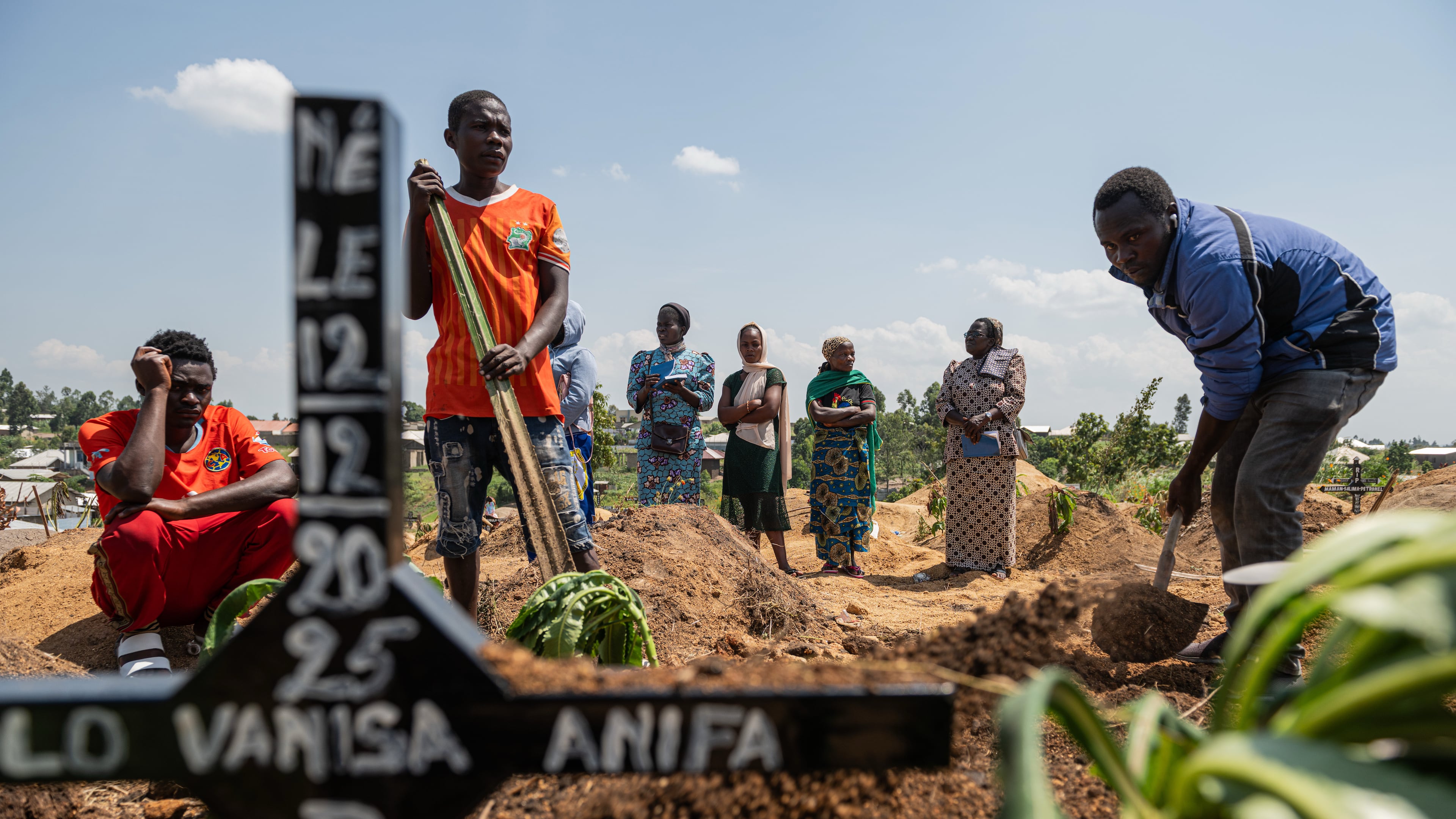 Relatives of Vanisa Anifa, a 6-month-old orphaned girl who died of Ebola, attend her burial, in Bunia, Congo, Friday, June 19, 2026. (AP Photo/Moses Sawasawa)