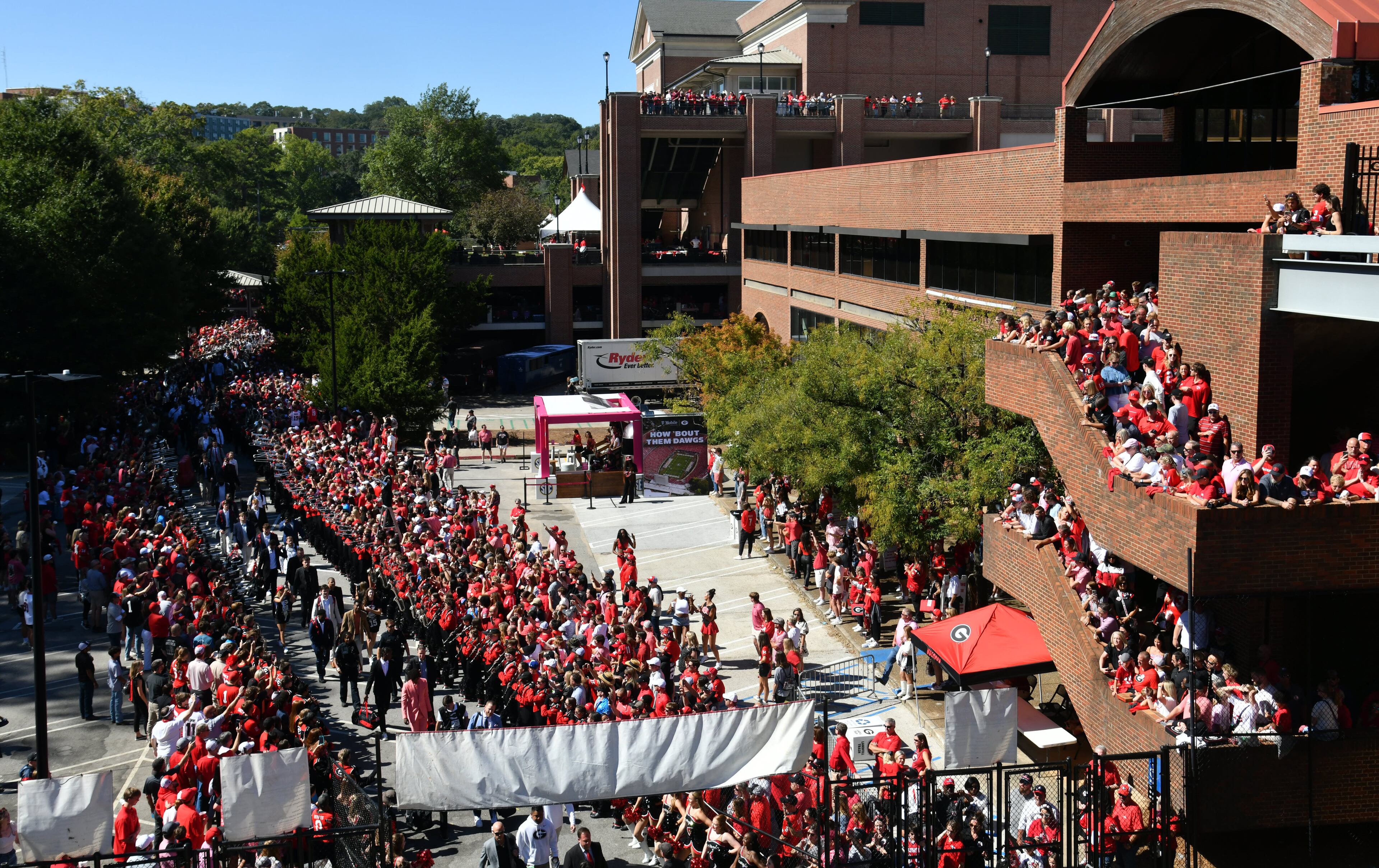 Georgia fans cheer as players and staff arrive during Dawgs Walk before their game against Mississippi State at Sanford Stadium, Saturday, October 12, 2024, in Athens. (Hyosub Shin / AJC)