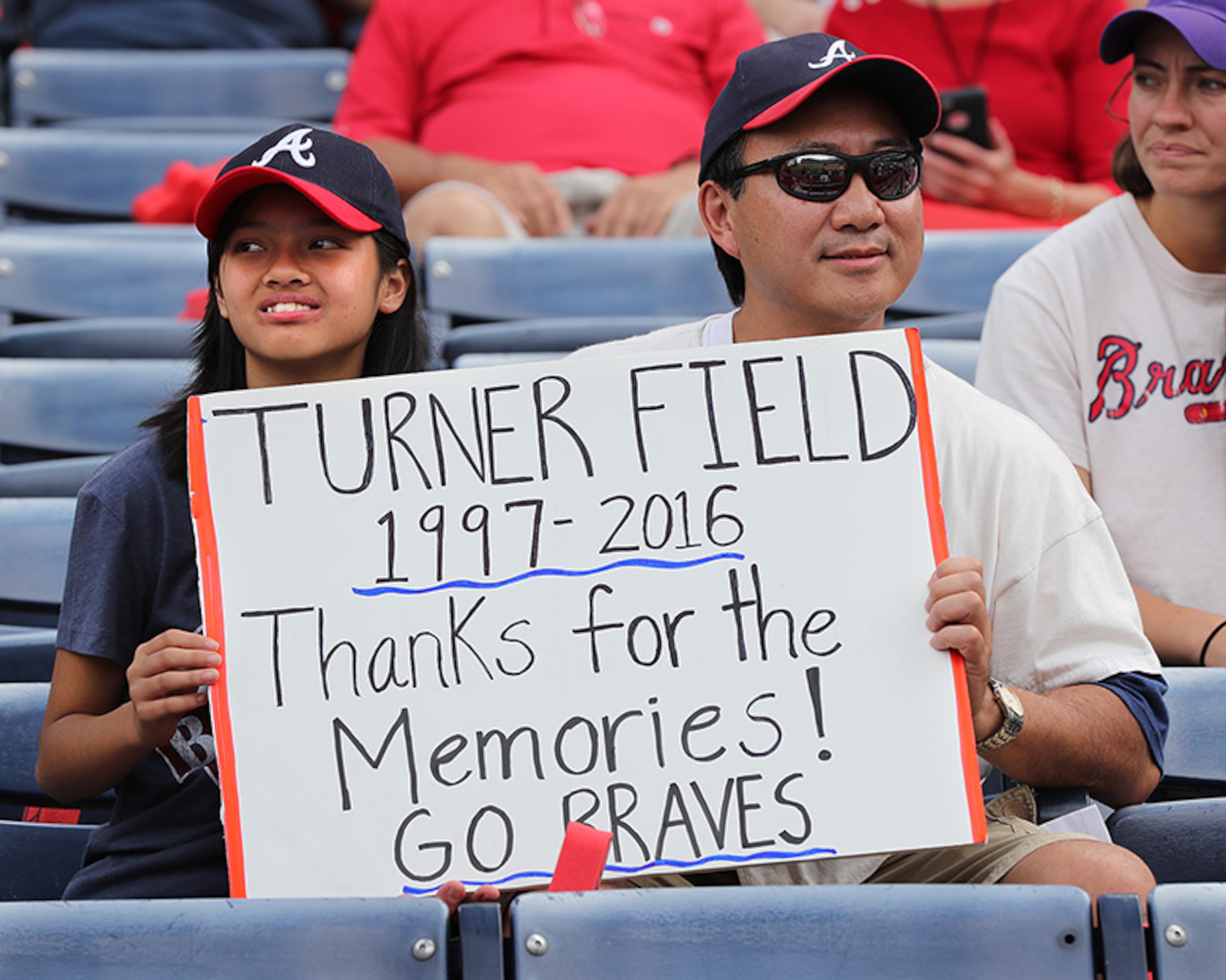 October 02, 2016 Atlanta: Jeff Kwan and his daughter Josie, Powder Springs, are on hand for the Braves final game at Turner Field on Sunday, Oct. 2, 2016, in Atlanta. The team will move to a new stadium in Cobb County for the 2017 season. Curtis Compton /ccompton@ajc.com