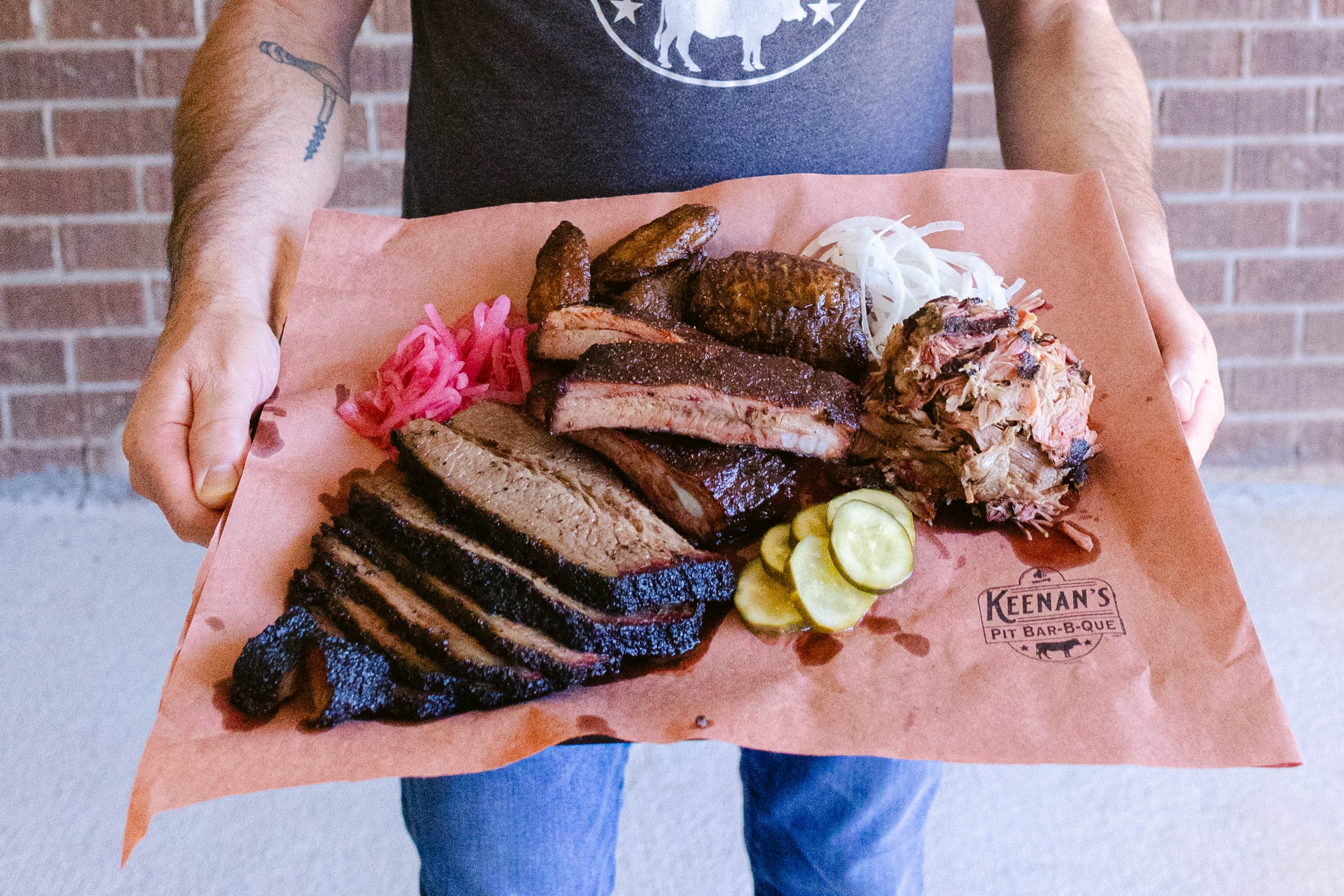 Keenan's Pit Barbecue’s platter, aptly named all the meats. It contains sliced prime brisket, St. Louis pork ribs, chicken wings and Carolina pulled pork. (Courtesy of Kelly Tran Photography)