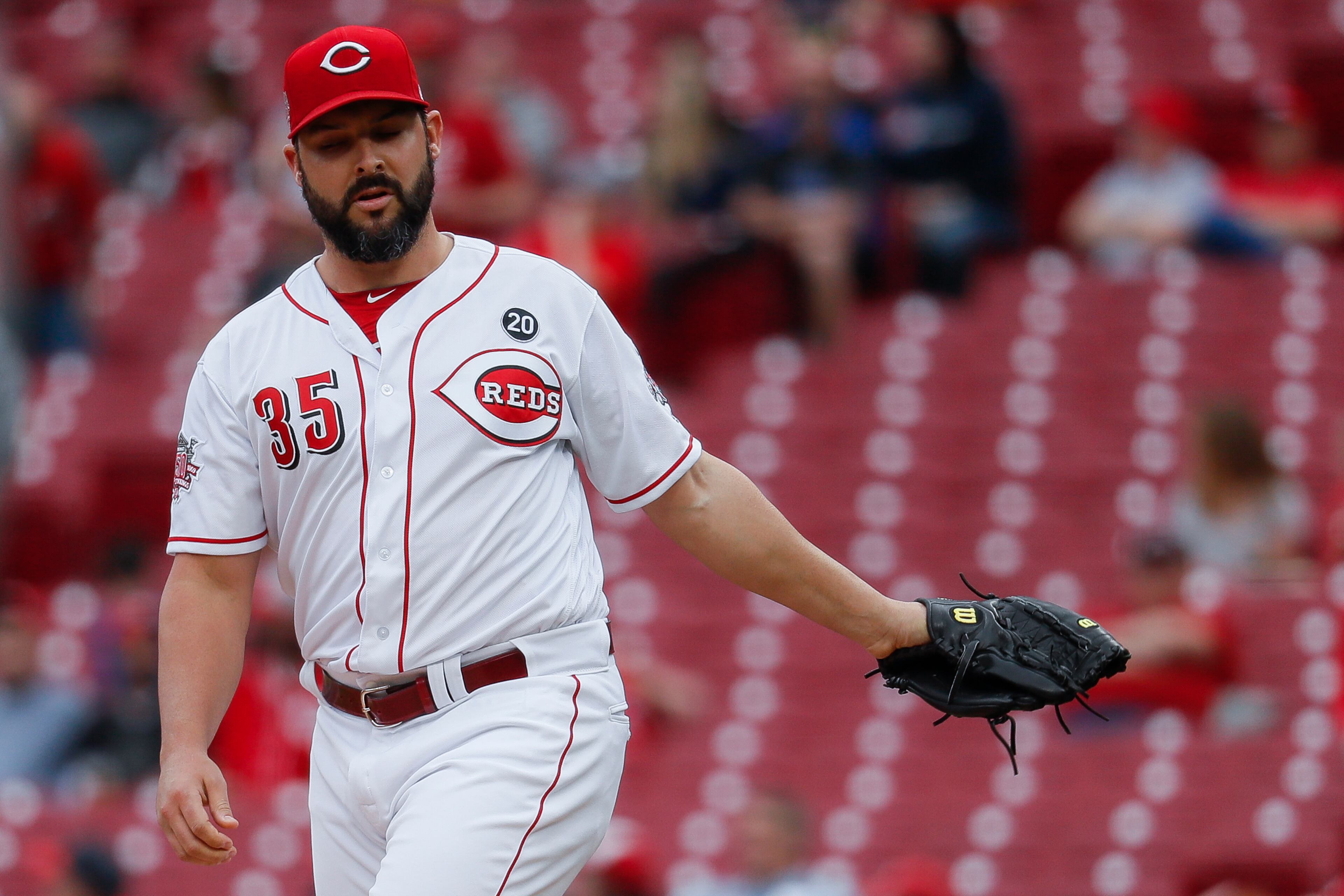 Cincinnati Reds starting pitcher Tanner Roark reacts after giving up a solo home run to Atlanta Braves' Ozzie Albies on the first pitch of the first inning of a baseball game, Wednesday, April 24, 2019, in Cincinnati. (AP Photo/John Minchillo)