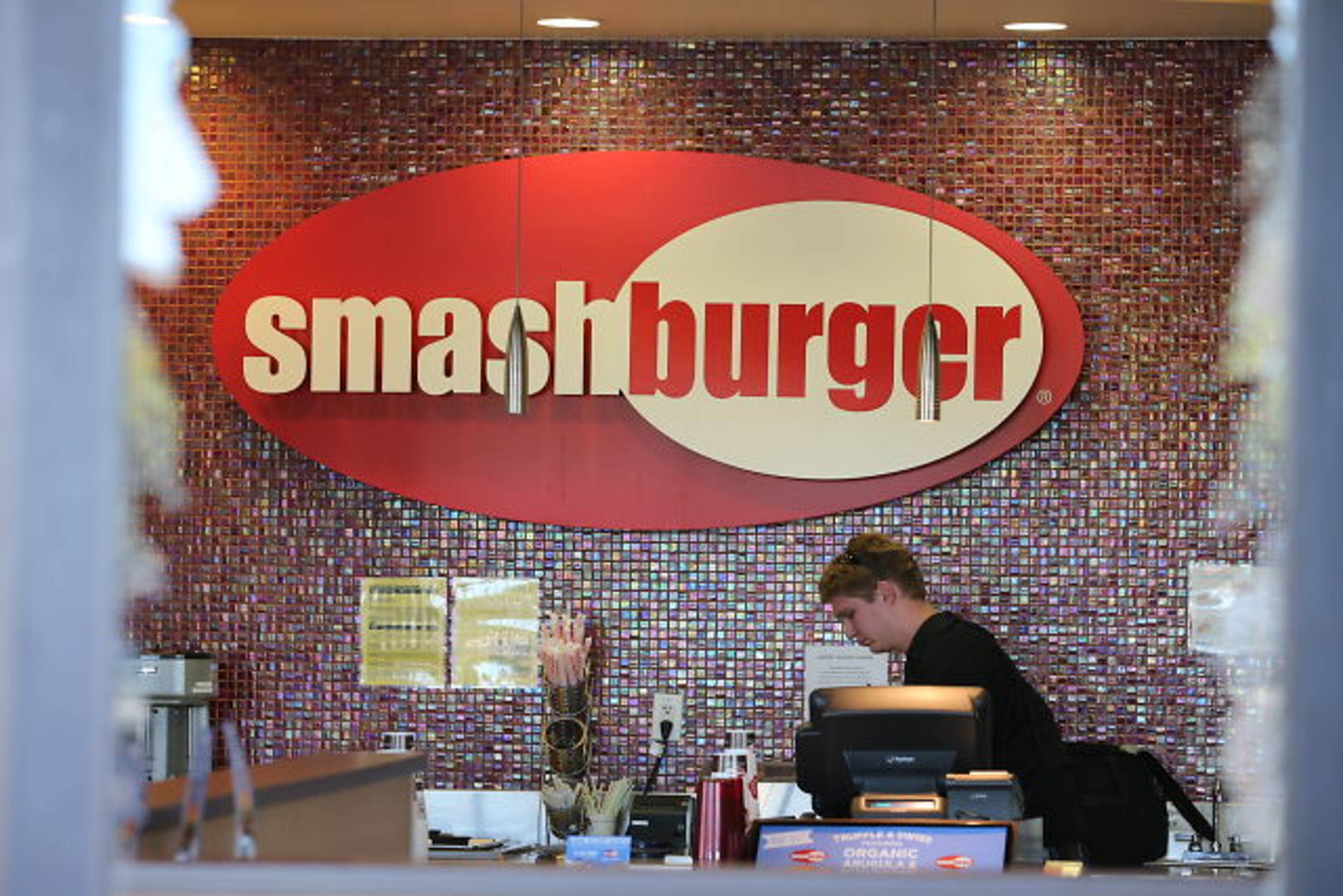 Smash-and-grab burglars hit the Smashburger restaurant and the Classic Touch Cleaners at the Buckhead Crossing shopping center just before daybreak Tuesday. JOHN SPINK / JSPINK@AJC.COM