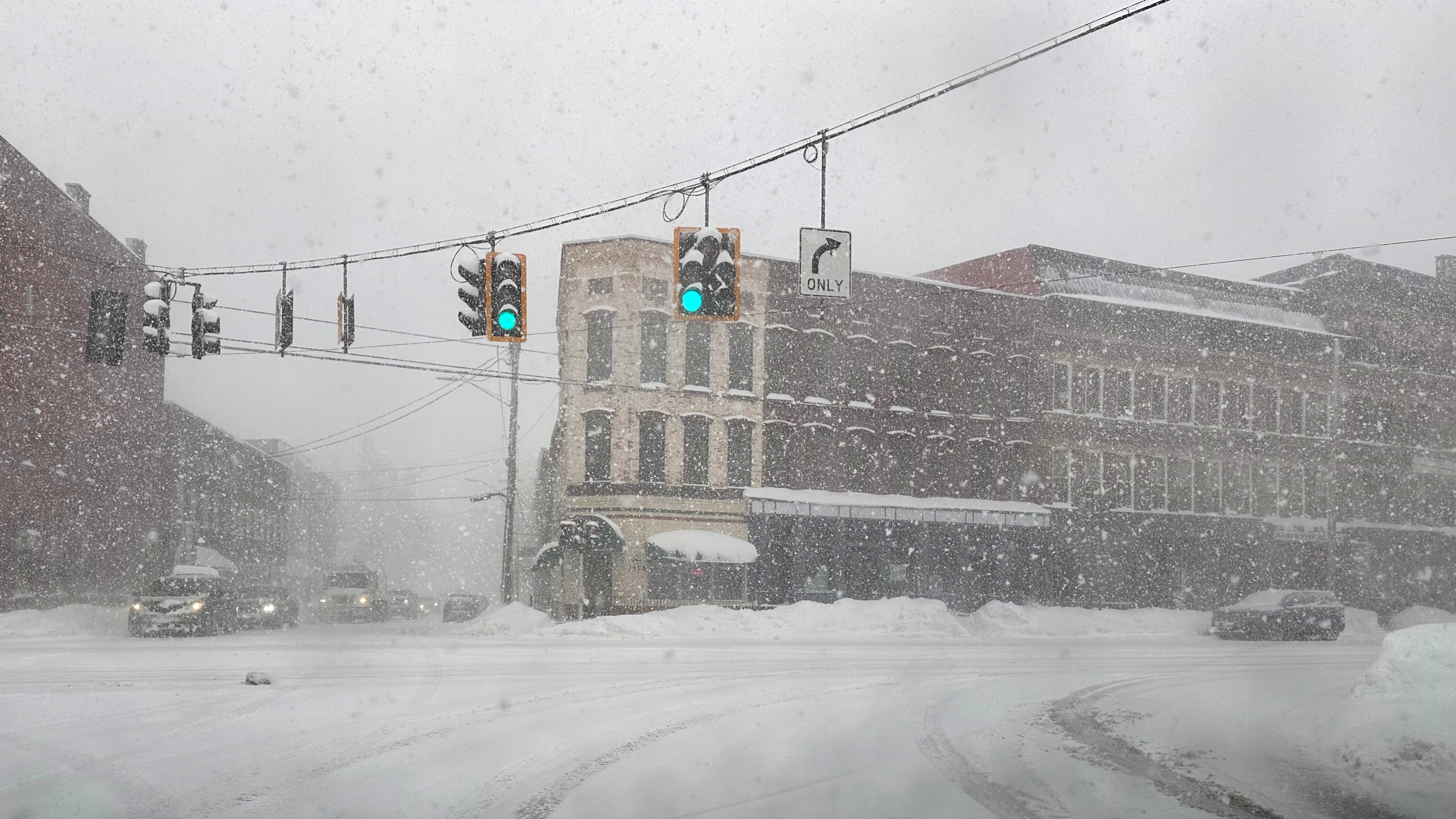 Fresh snow blows through an intersection in Lowville, N.Y., on Thursday, Jan. 22, 2026. (AP Photo/Cara Anna)