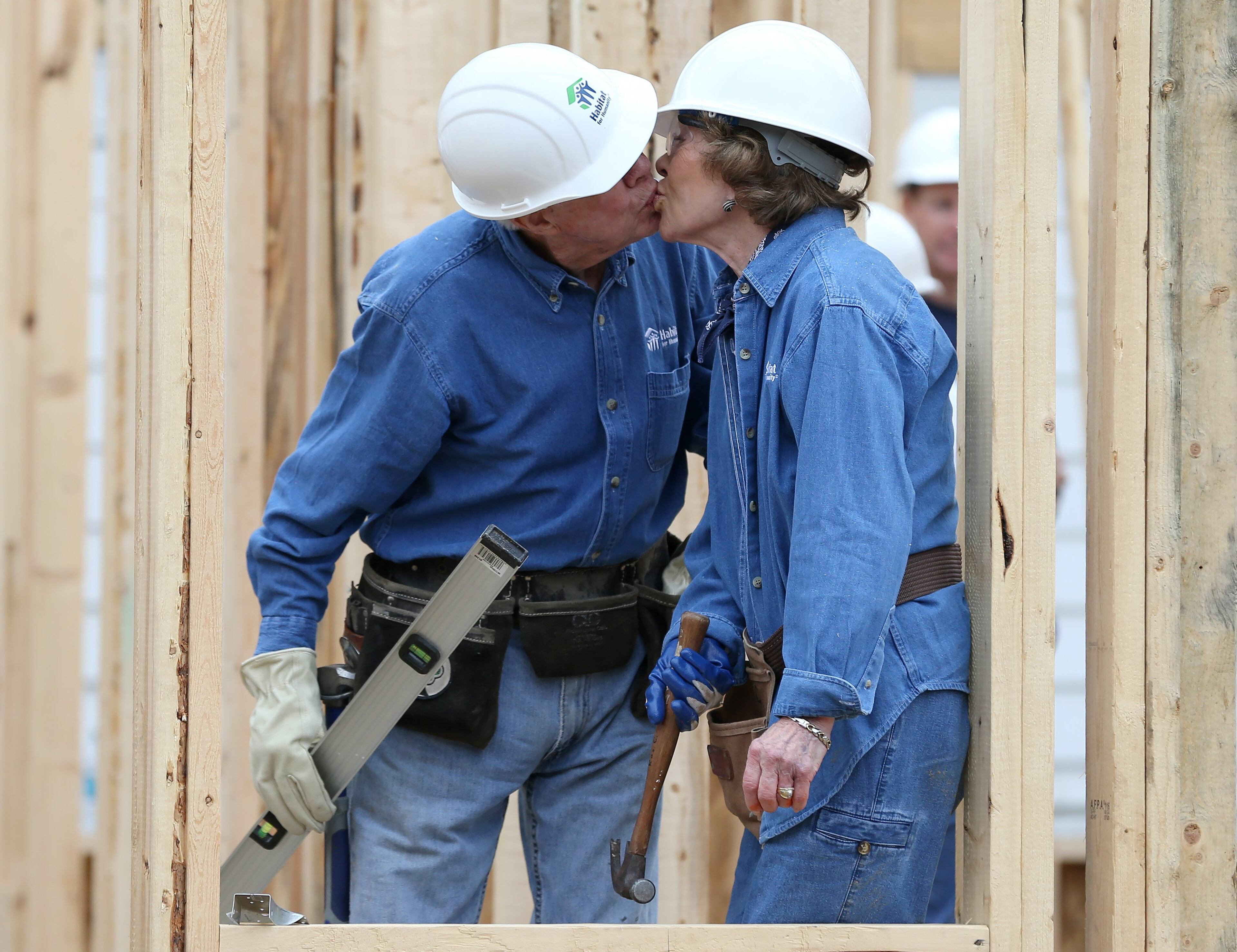 November 2, 2015 Memphis: Former President Jimmy Carter sneaks a kiss with Rosalynn while the couple was working on a Habitat for Humanity build Monday morning November 2, 2015 in Memphis. Ben Gray / bgray@ajc.com