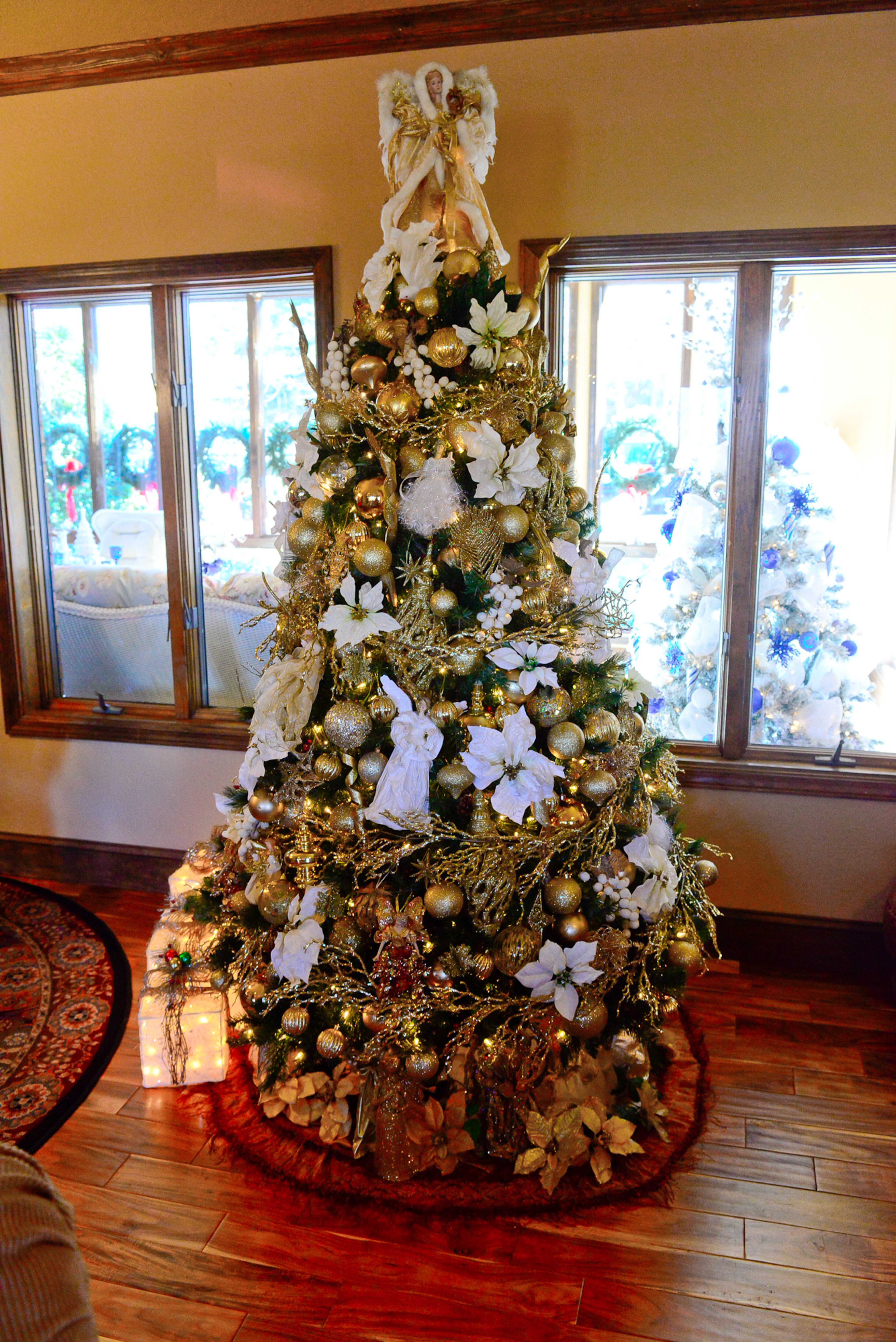 Marcelle Rolan collects angels, which are all over the house and in her Christmas trees. Rolan gathers holiday decor ideas throughout the year by looking at displays at flower shops and saving ideas from magazines including Southern Living, Architectural Digest and Traditional Home.